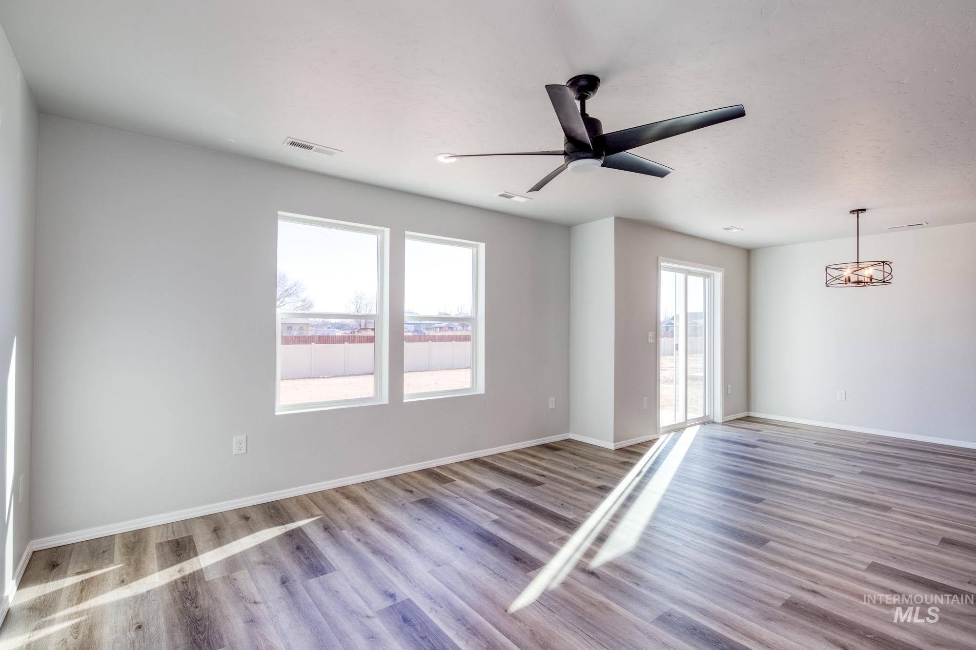 Spare room with light wood-style floors and ceiling fan