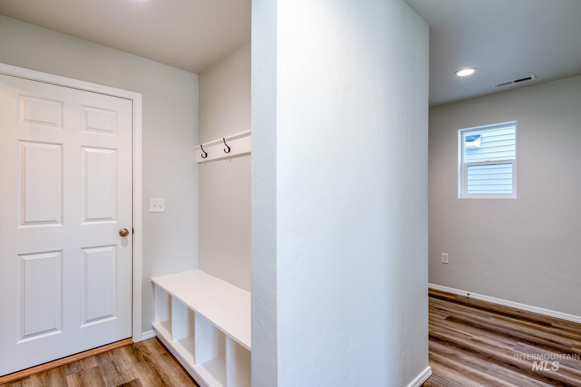 Mudroom featuring light wood-style floors and recessed lighting