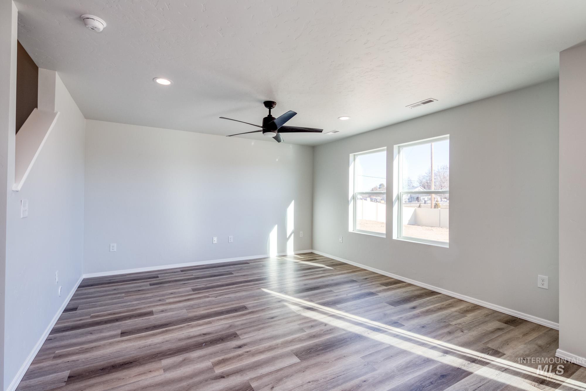 Unfurnished room with recessed lighting, light wood-type flooring, and ceiling fan