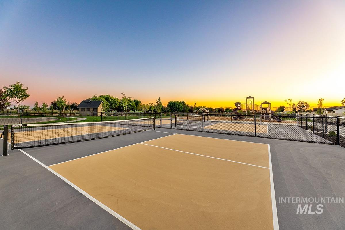 View of tennis court featuring community basketball court