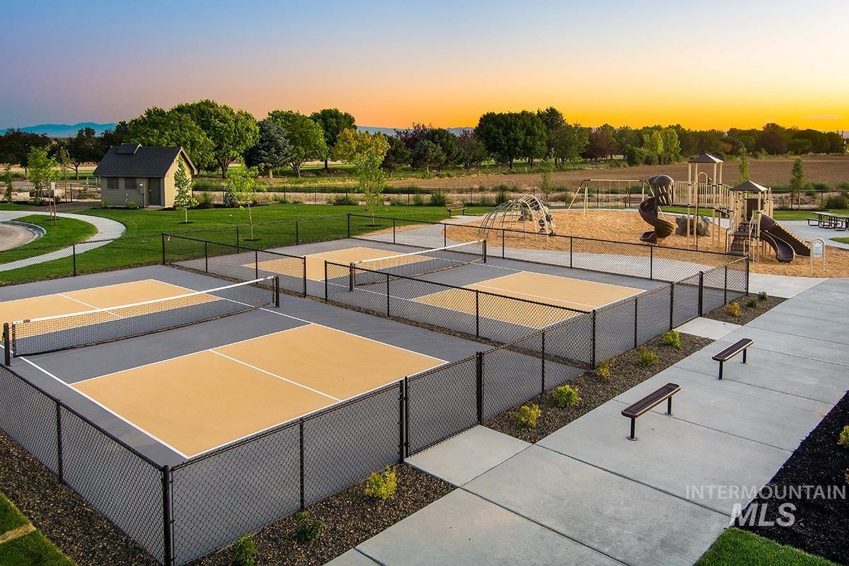View of tennis court featuring community basketball court