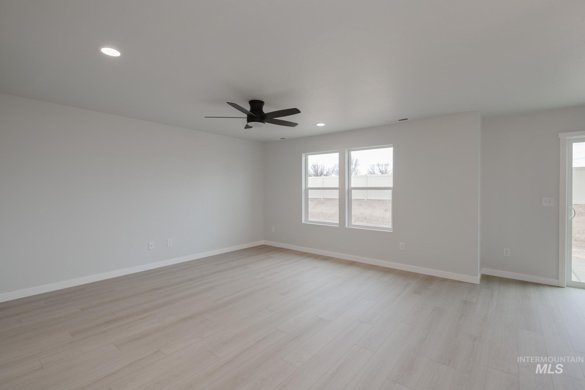 Unfurnished room with recessed lighting, light wood-style floors, and ceiling fan