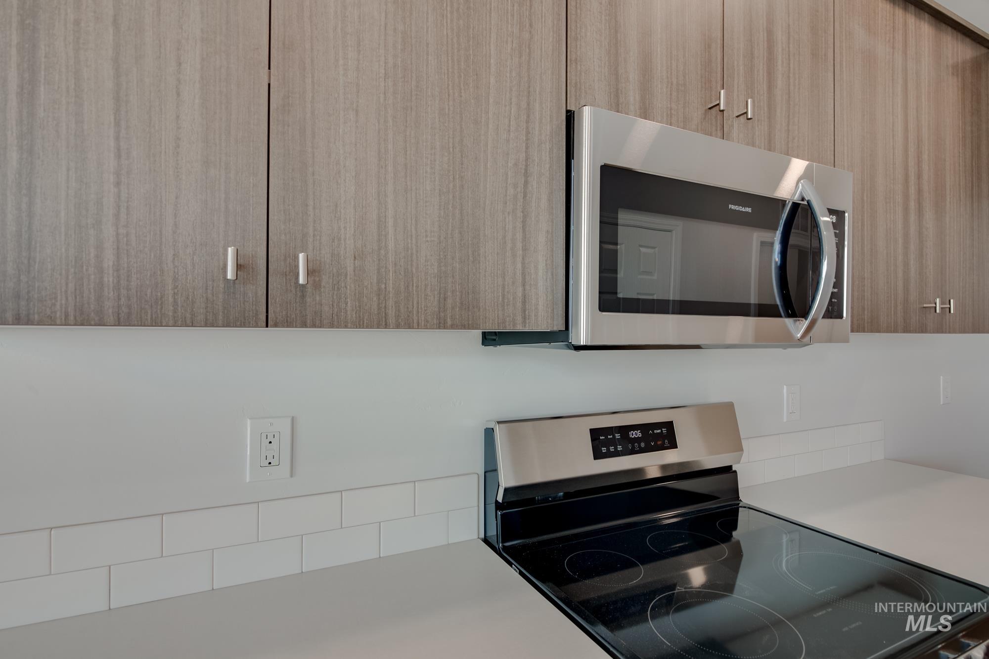 Kitchen featuring stainless steel appliances and modern cabinets