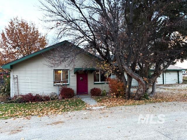 View of front facade featuring a garage