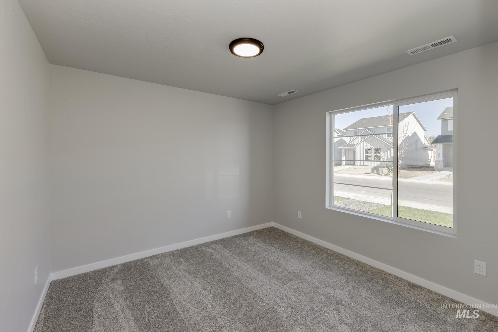 Unfurnished room featuring carpet