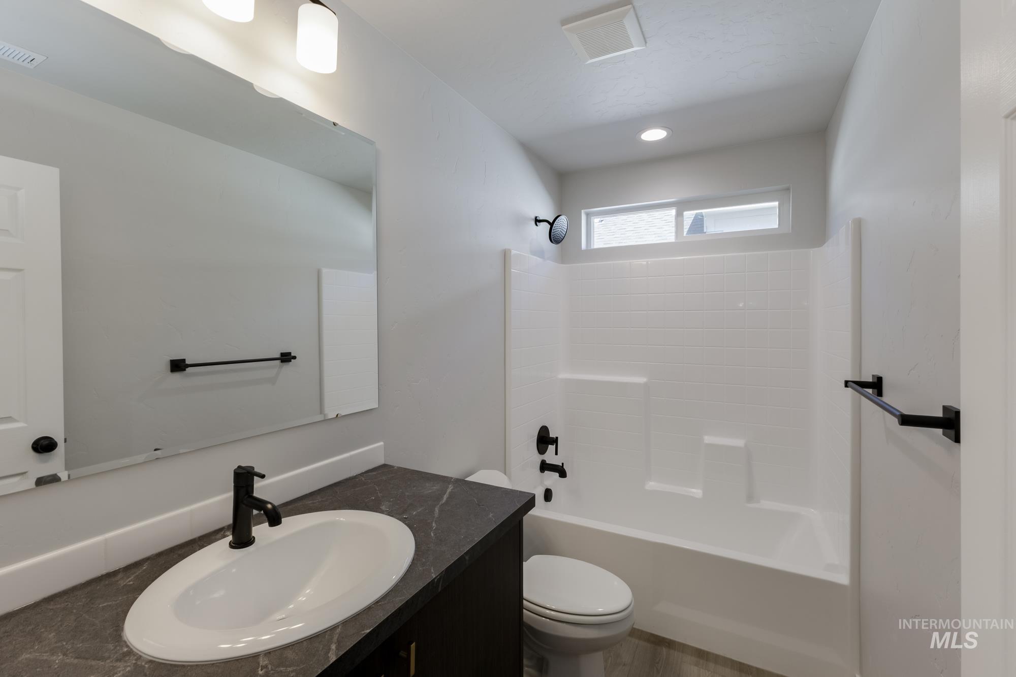 Full bathroom with vanity and shower / bath combination