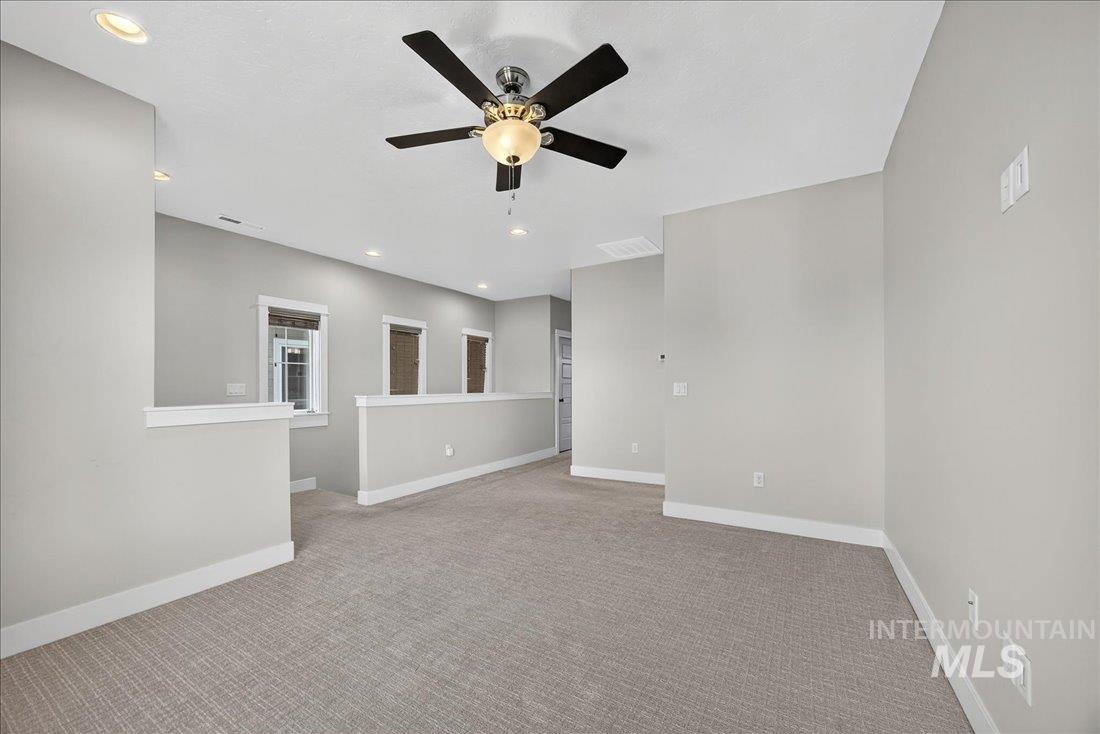 Carpeted spare room with recessed lighting and ceiling fan