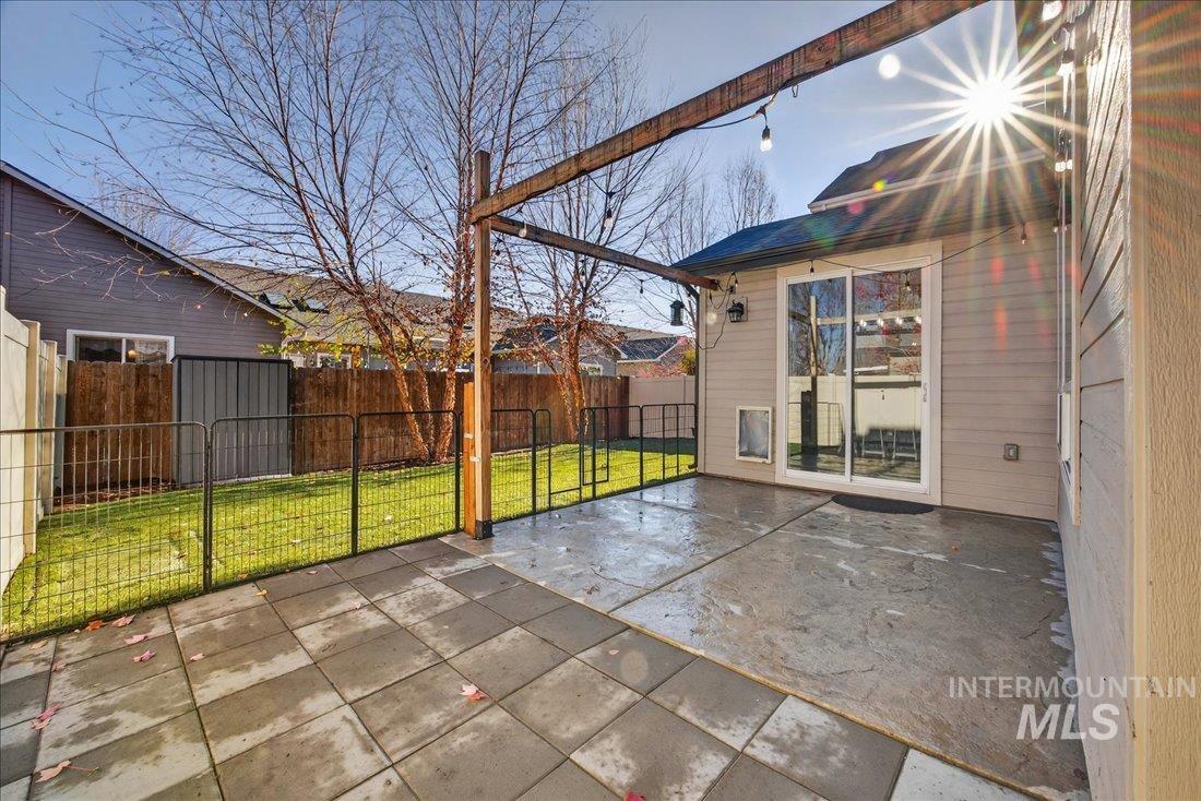 Fenced backyard featuring a patio area
