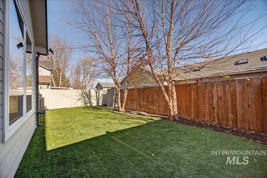 View of fenced backyard