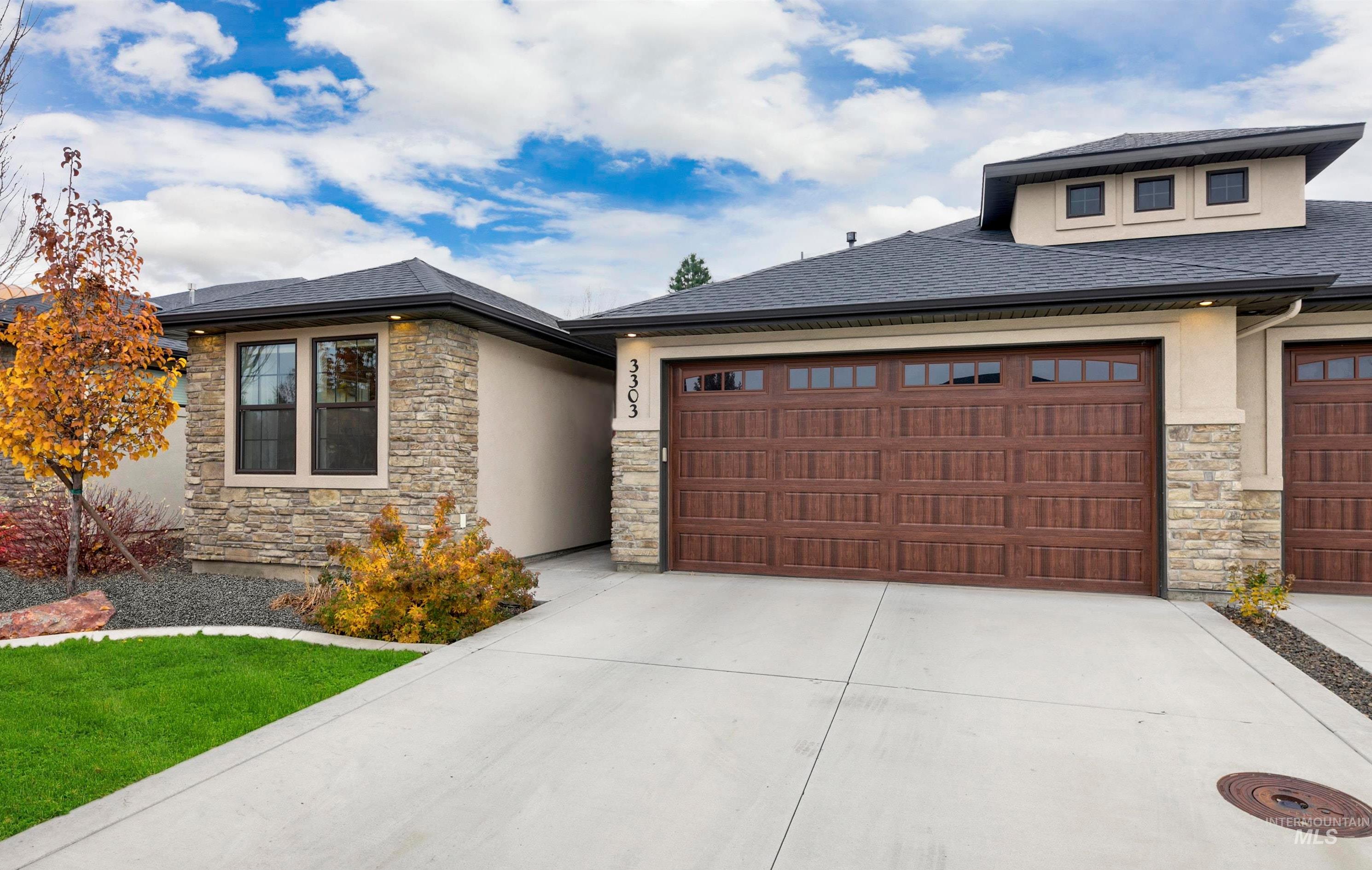 Home near Eagle Island State Partk with stucco siding, stone siding, and a private street in a gated neighborhood.