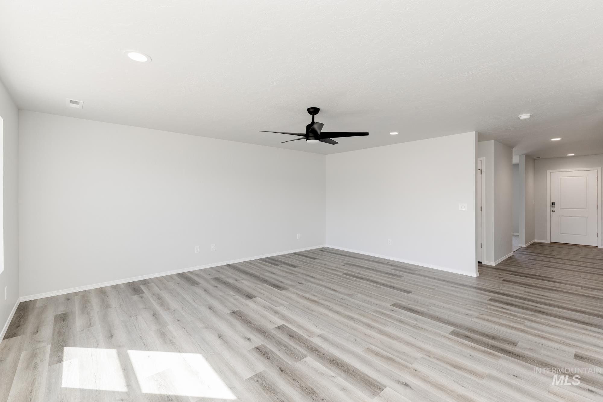 Unfurnished room featuring light wood finished floors, recessed lighting, and ceiling fan