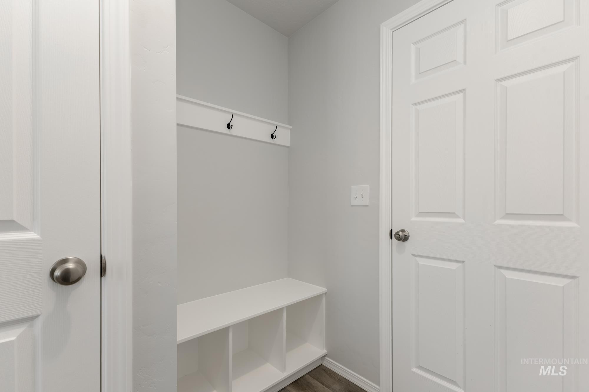 Mudroom with dark wood-style flooring