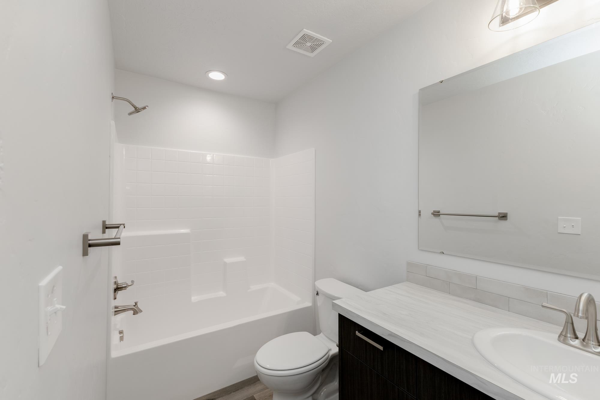 Full bathroom with shower / bathtub combination and vanity