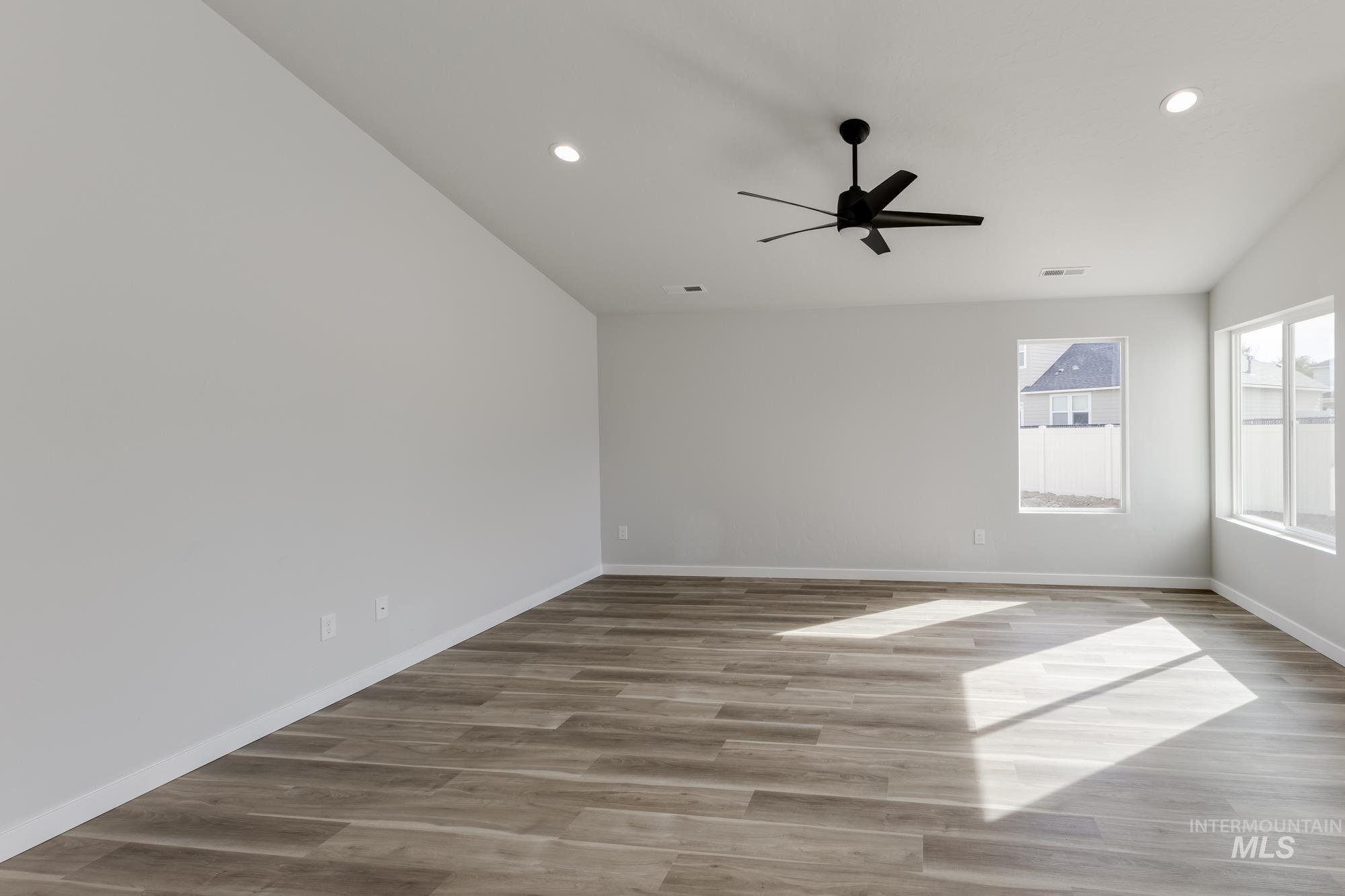 Spare room with light wood-style flooring, recessed lighting, and a ceiling fan