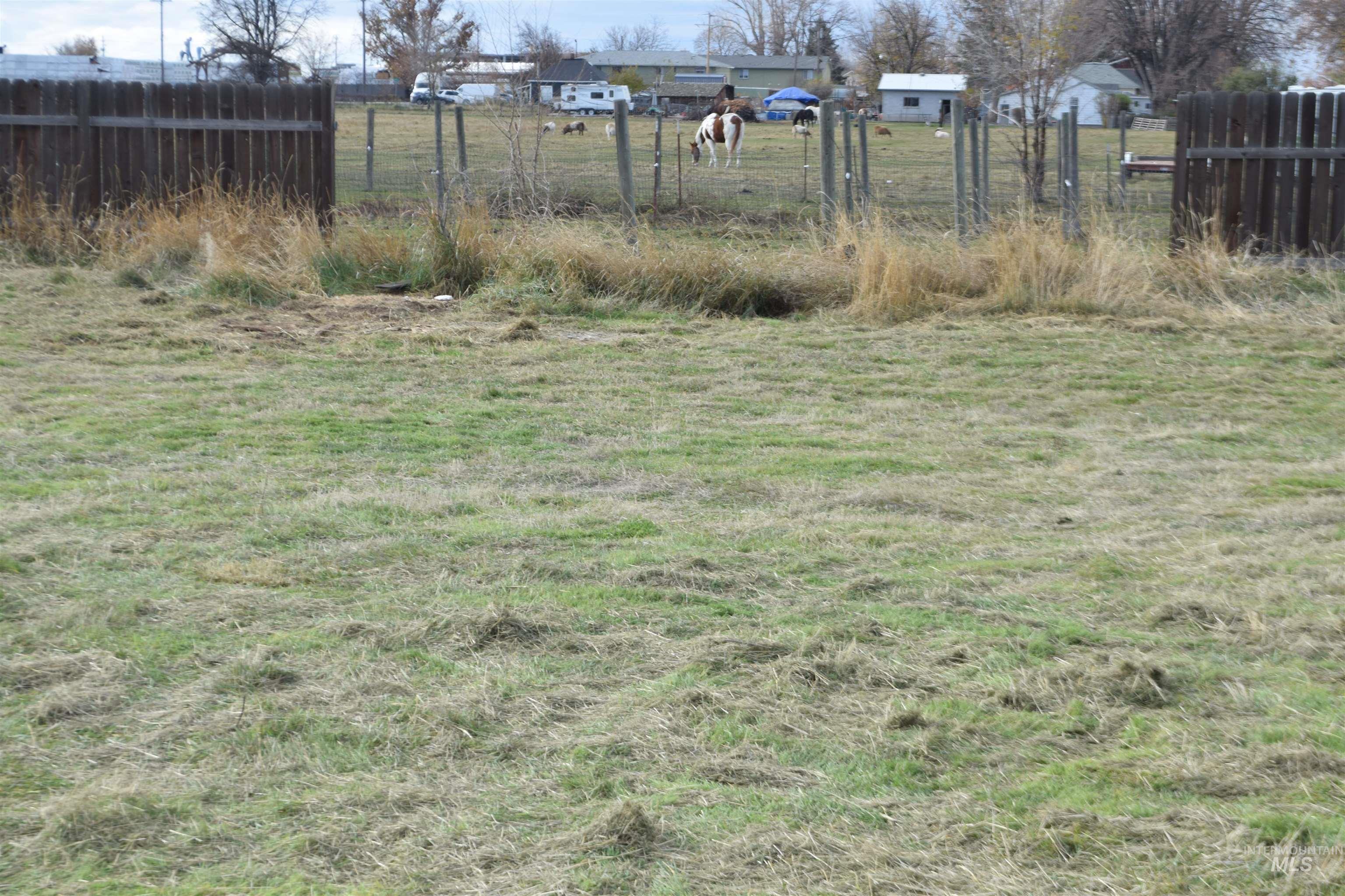 View of yard with a rural view