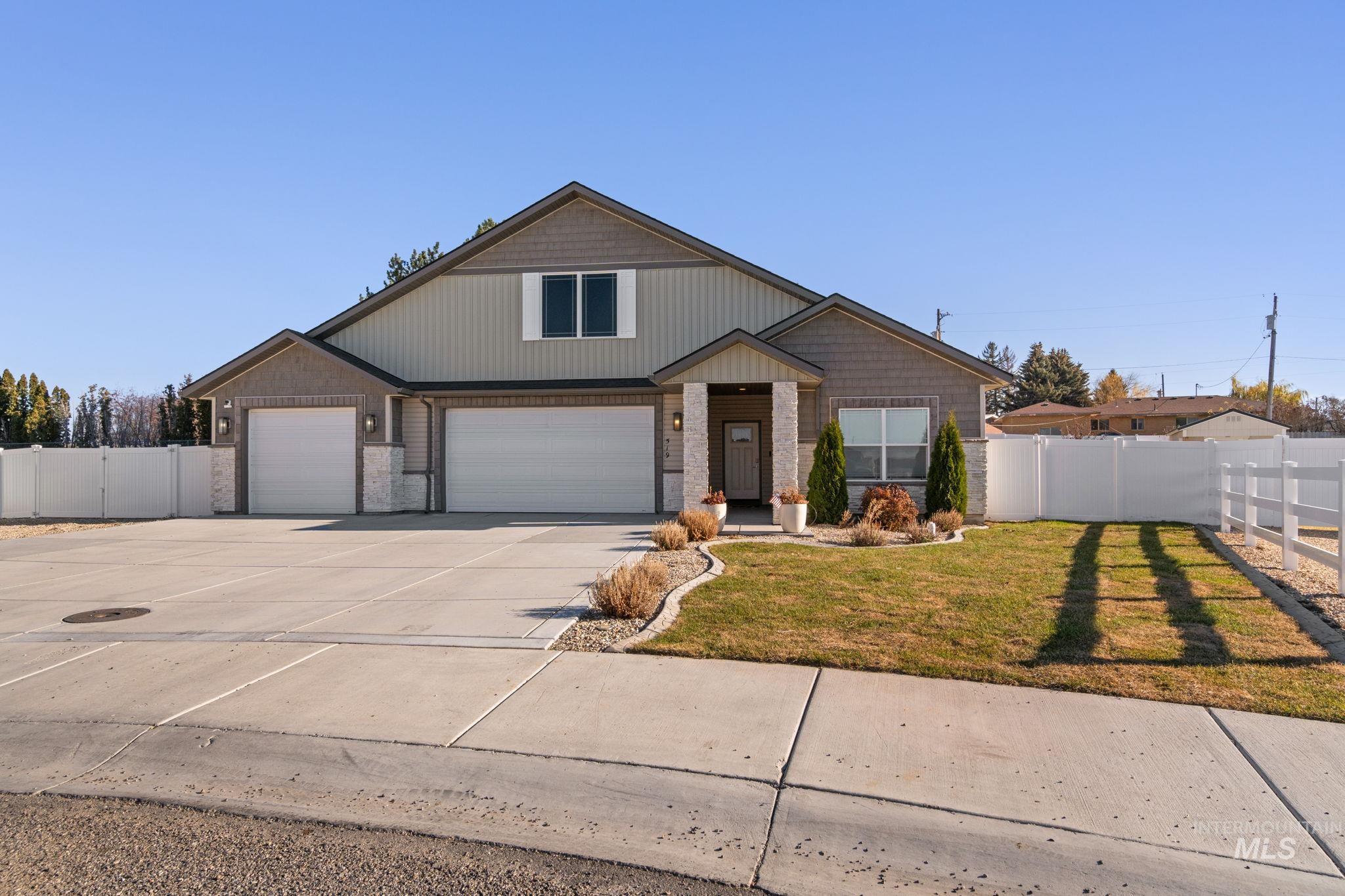 View of front of property featuring concrete driveway