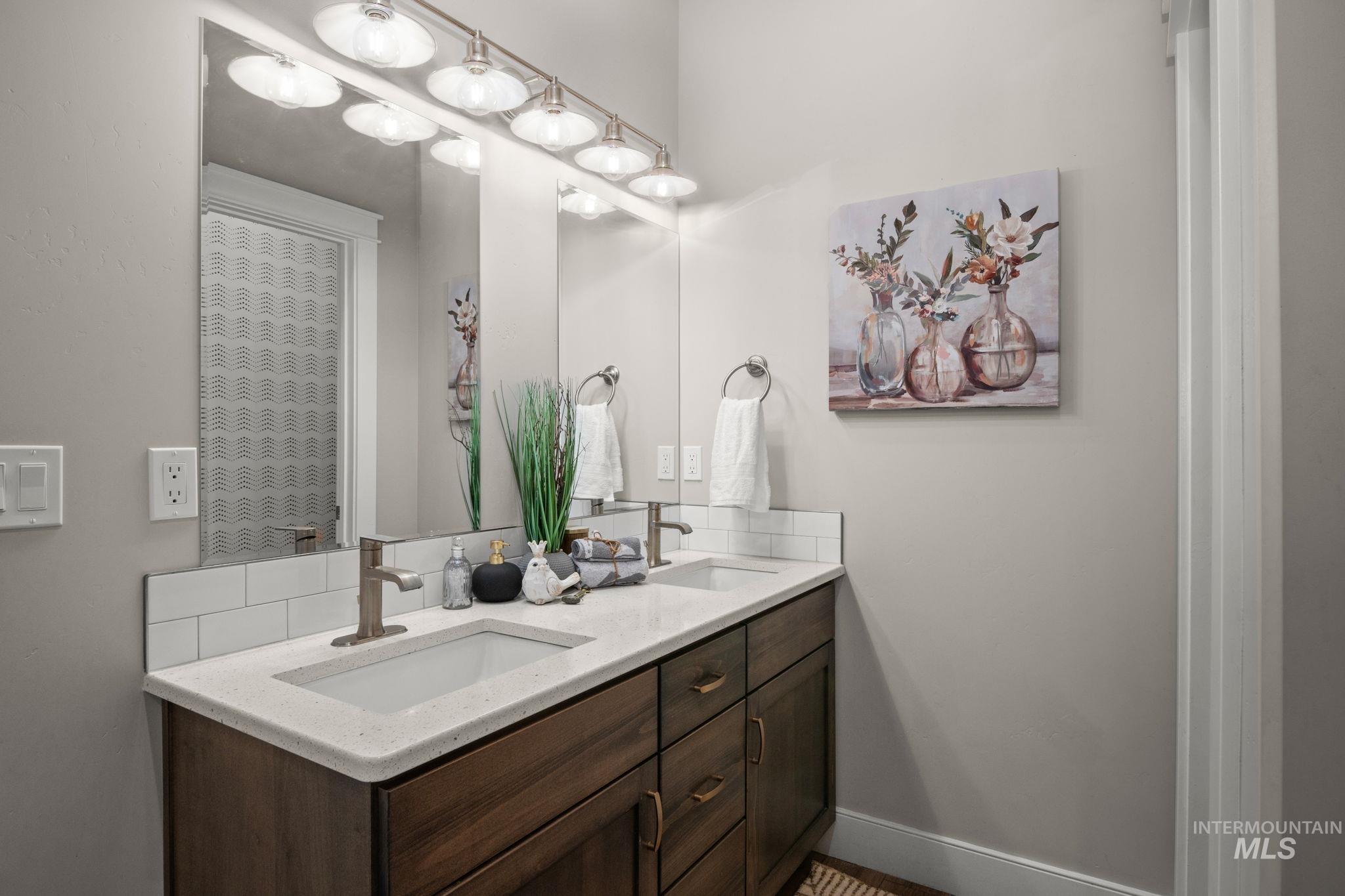 Bathroom featuring double vanity