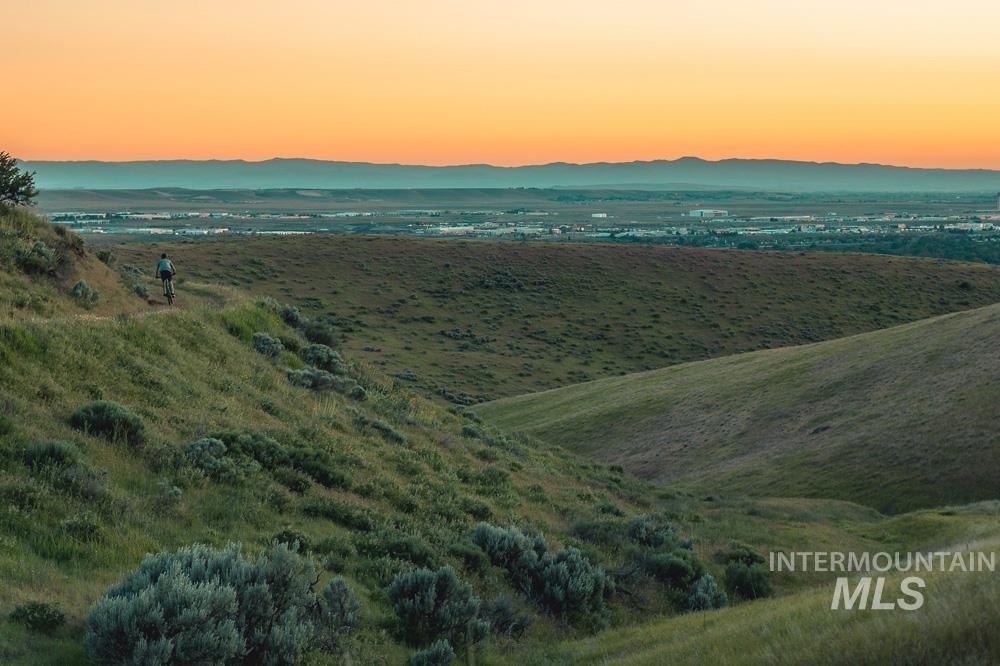 Aerial view at dusk of a mountain view and a view of rural / pastoral area