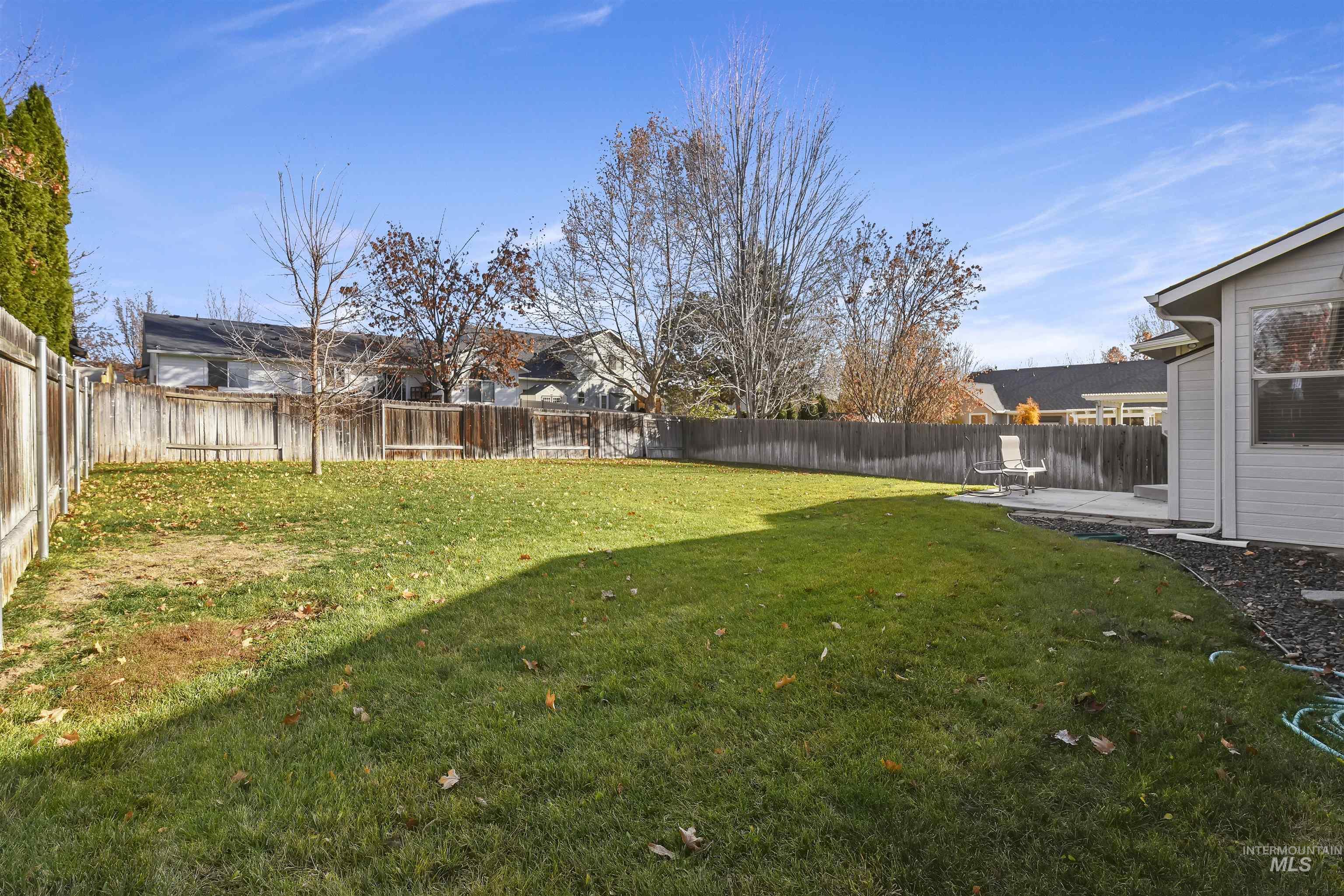 Fenced backyard featuring a patio area