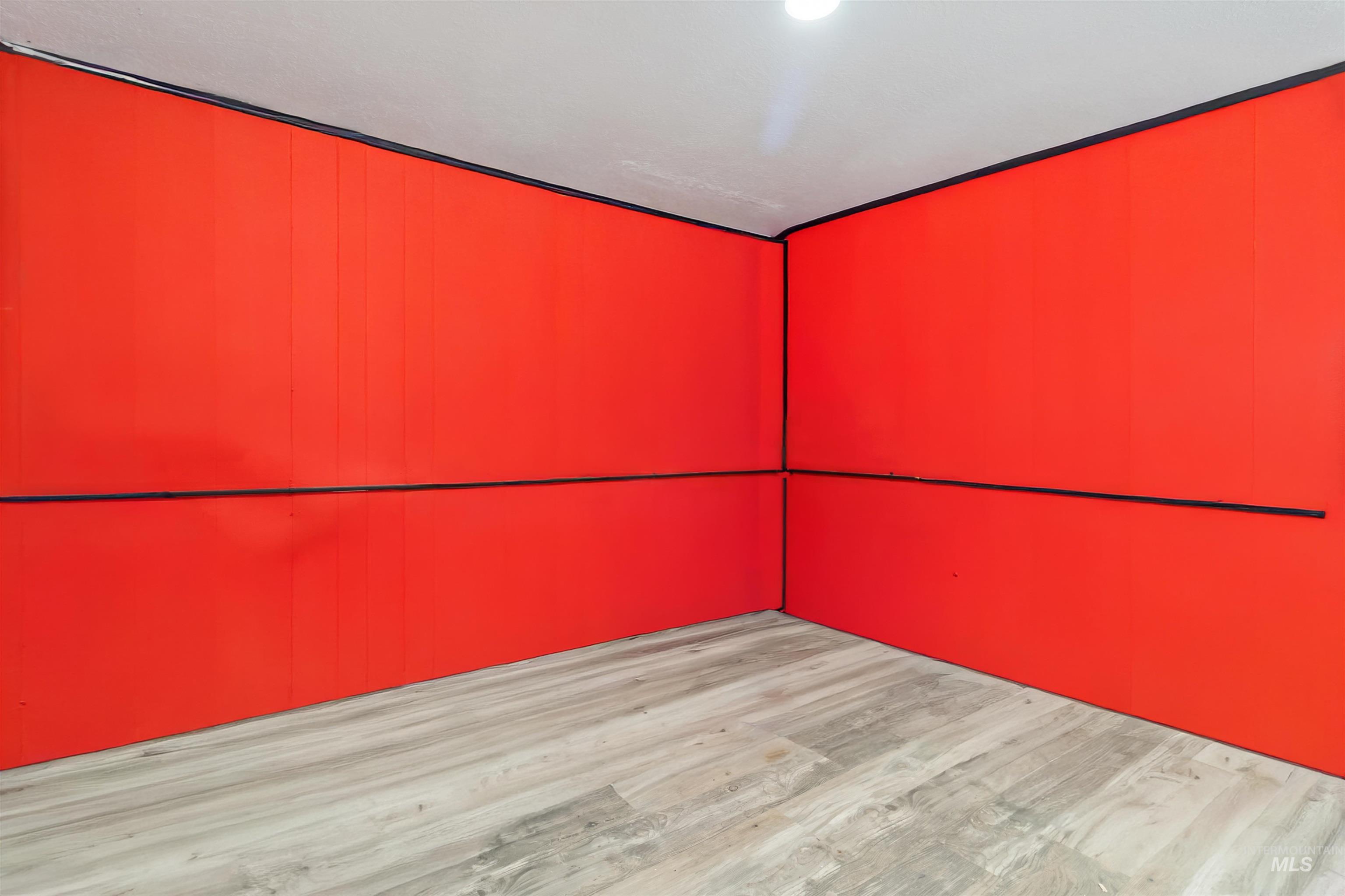 Unfurnished room with wood finished floors