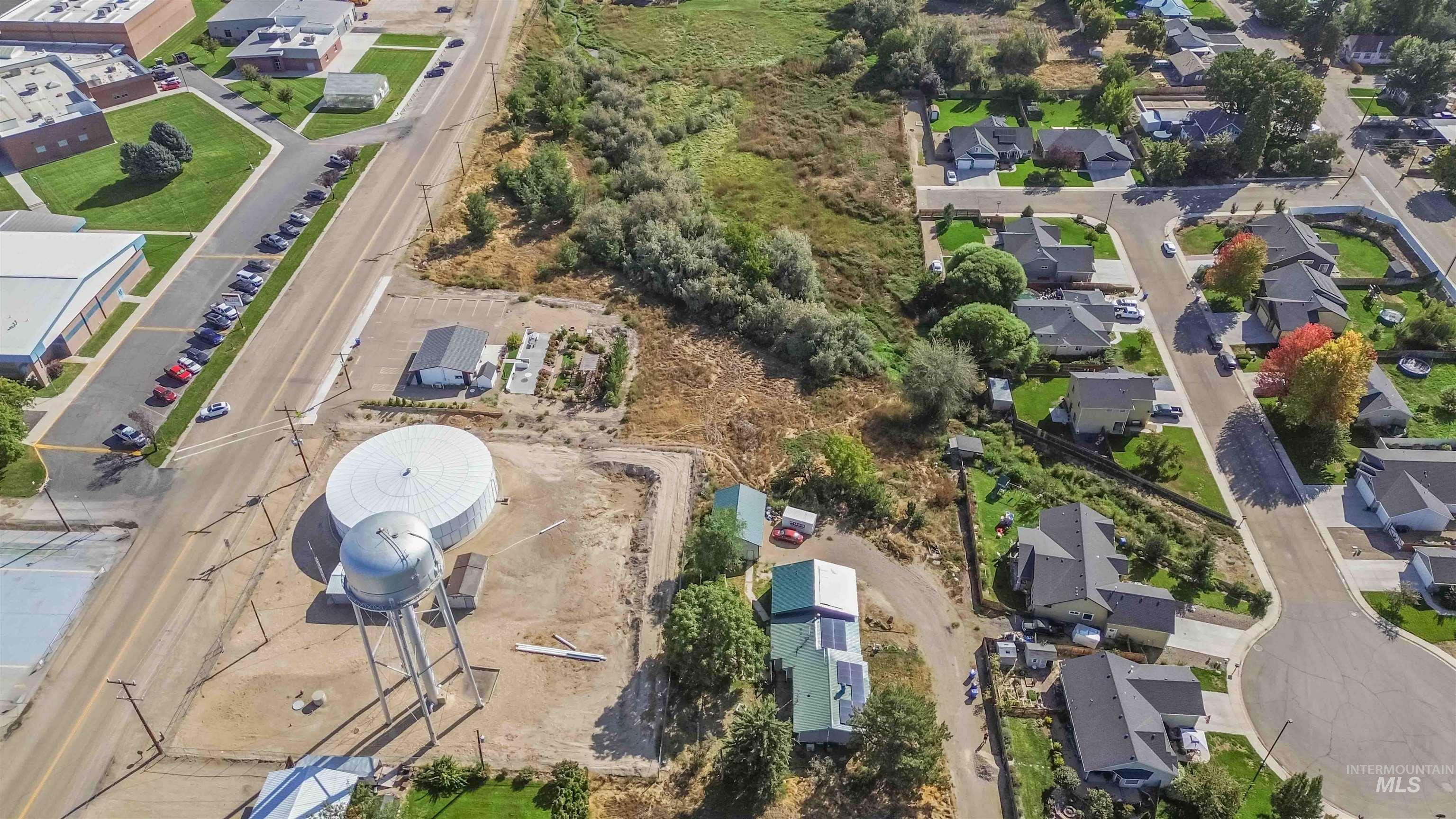 Aerial view of property's location featuring nearby suburban area