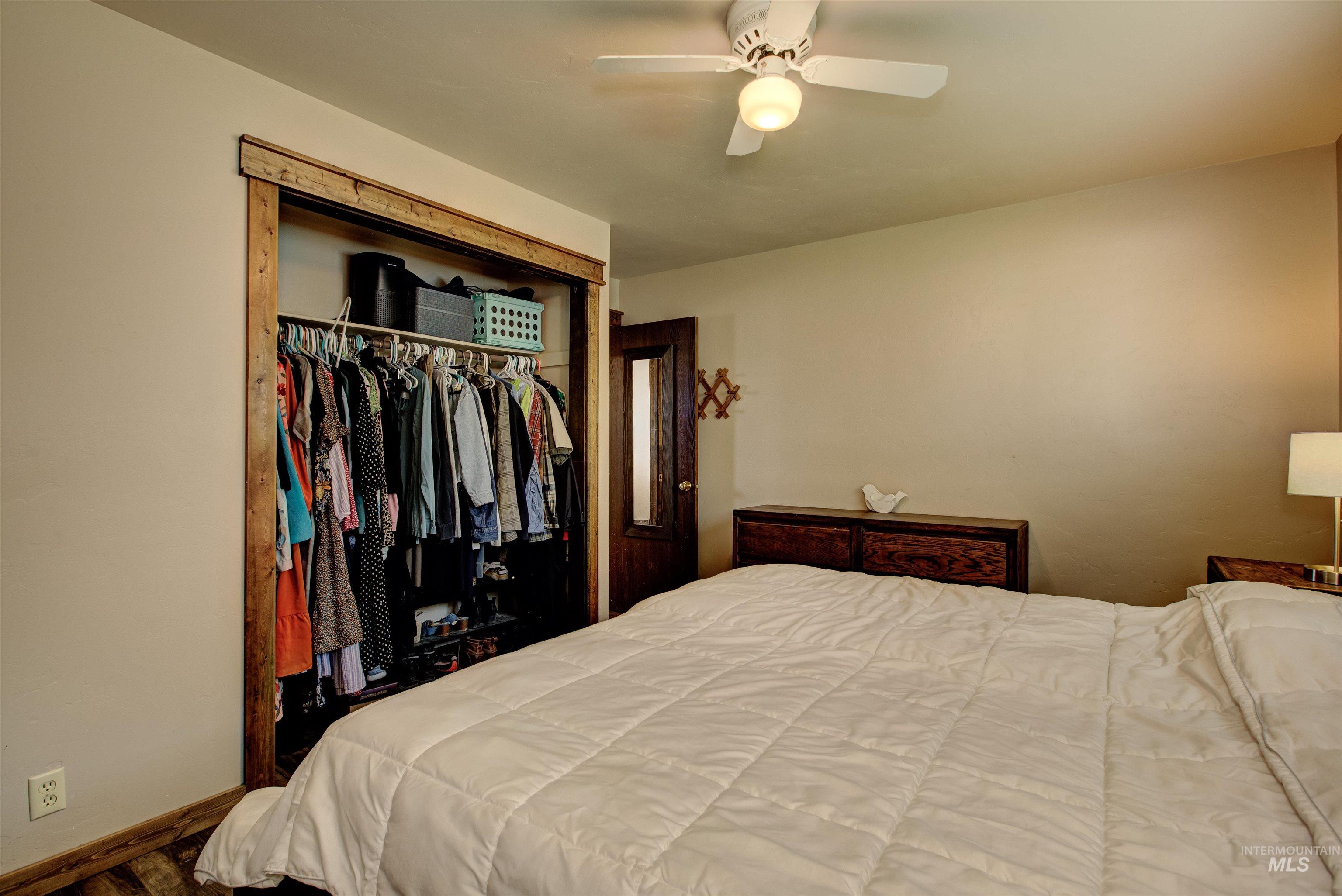 Bedroom featuring a closet and ceiling fan