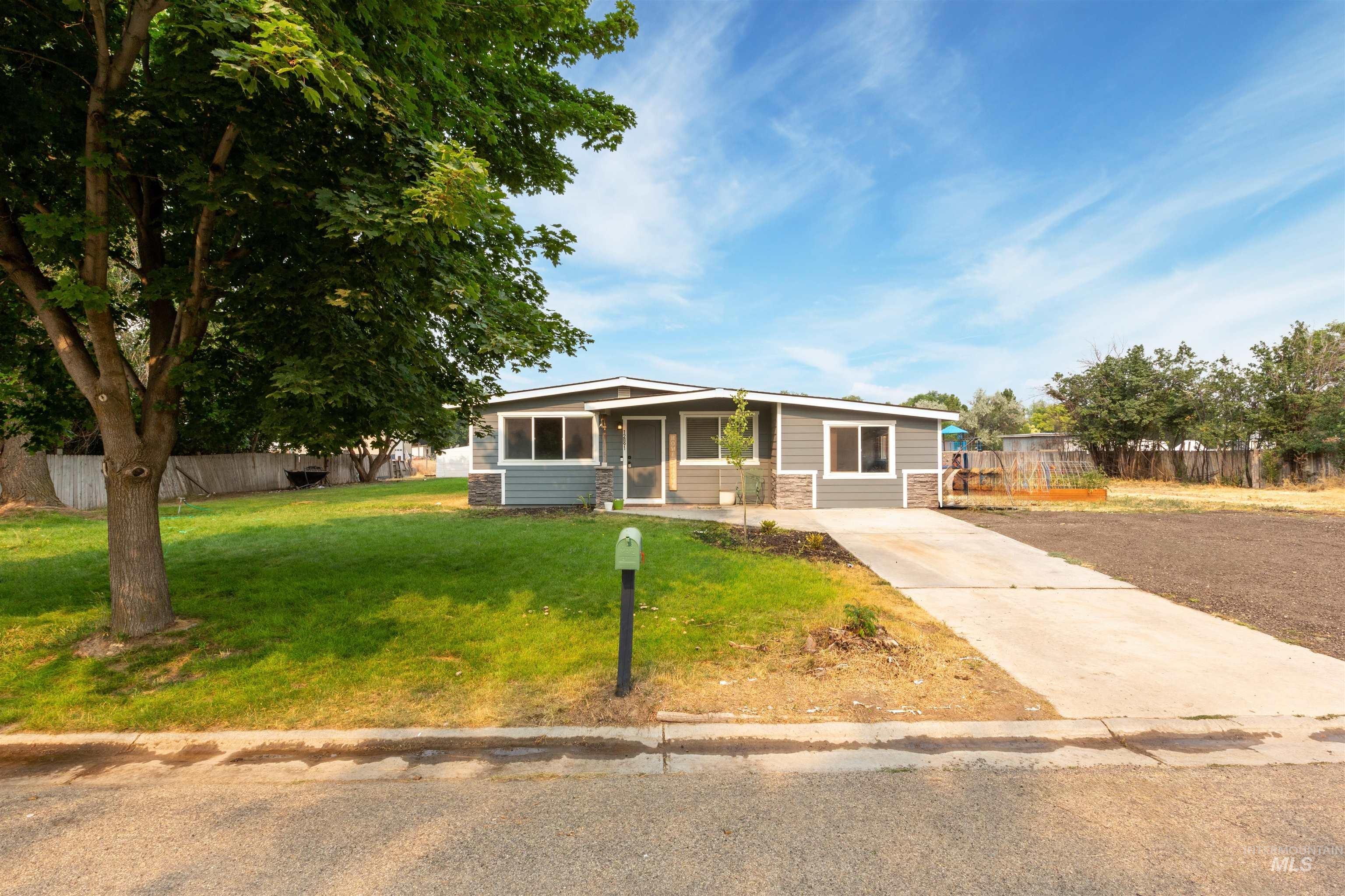 View of front of property with concrete driveway
