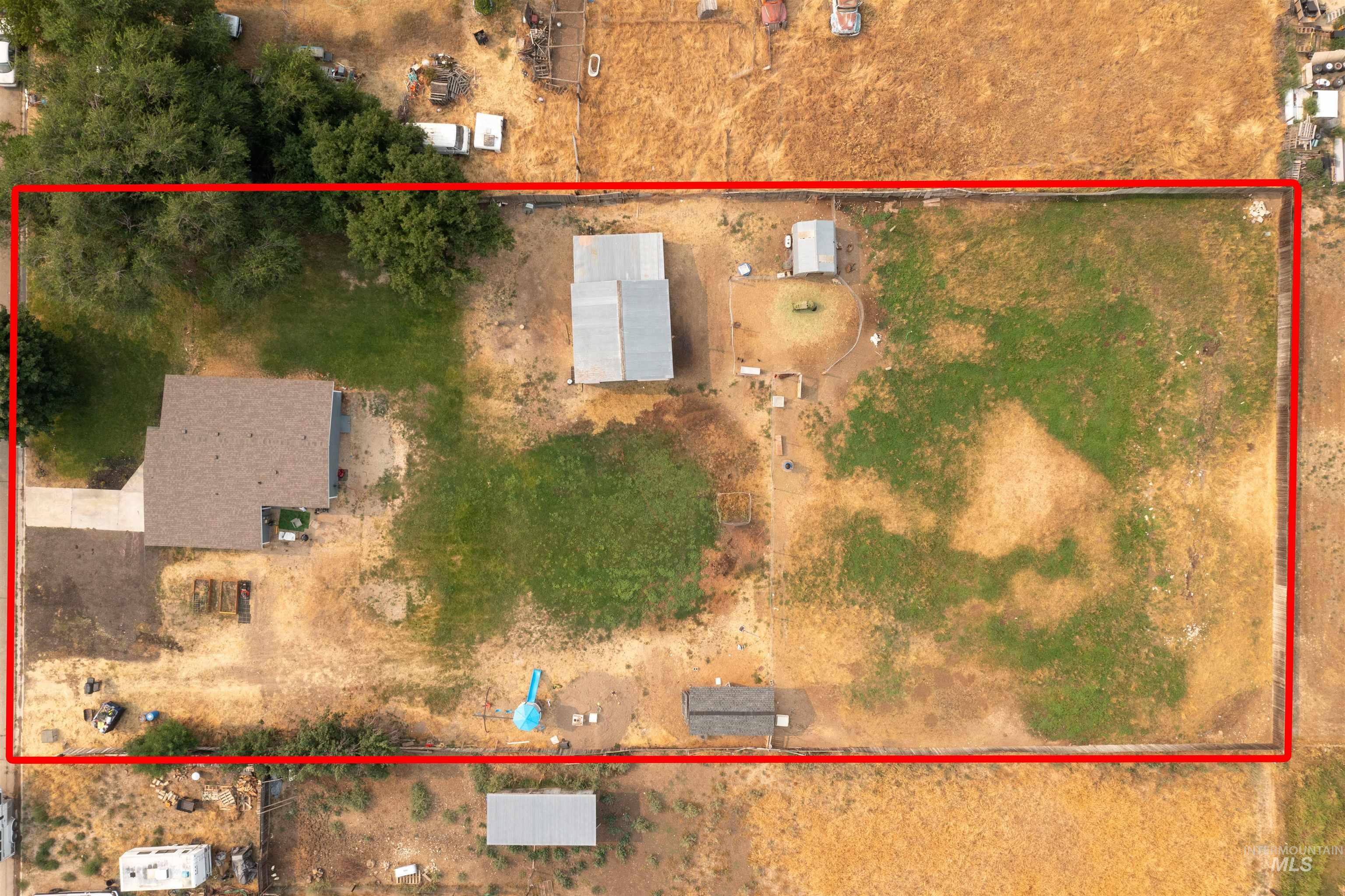 Aerial view of property and surrounding area with property boundaries highlighted