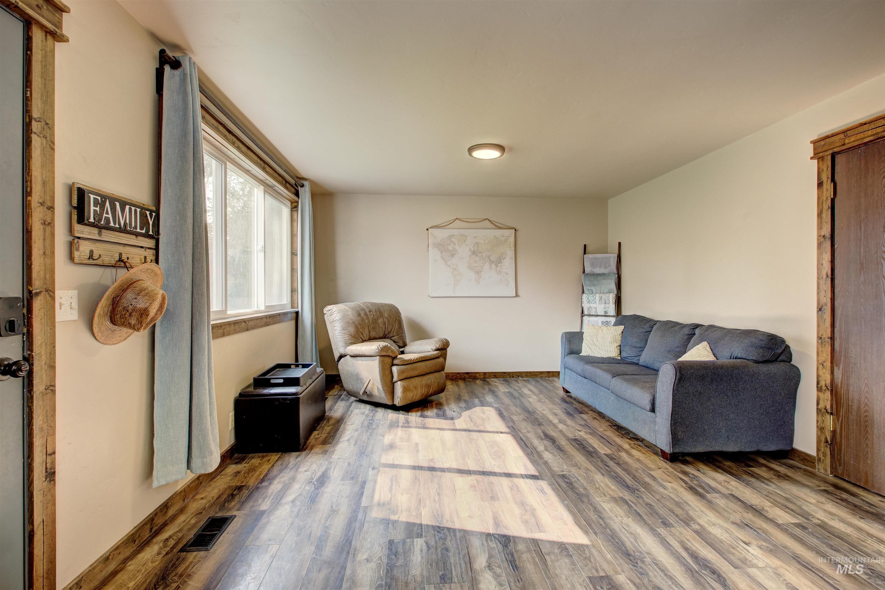 Living area featuring wood finished floors