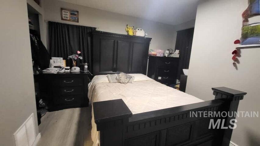 Bedroom with wood finished floors