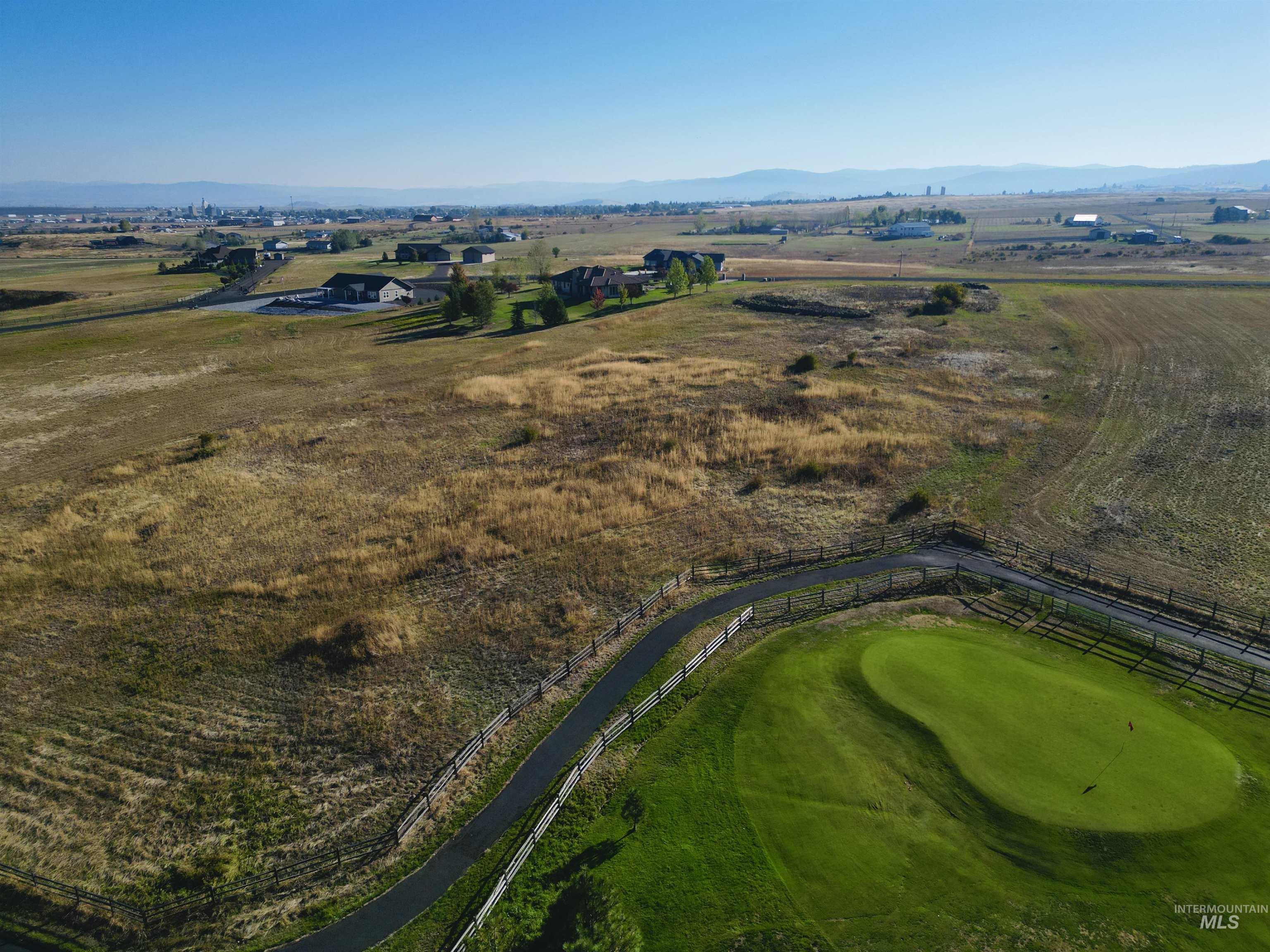 Aerial view of property's location featuring mountains and rural landscape