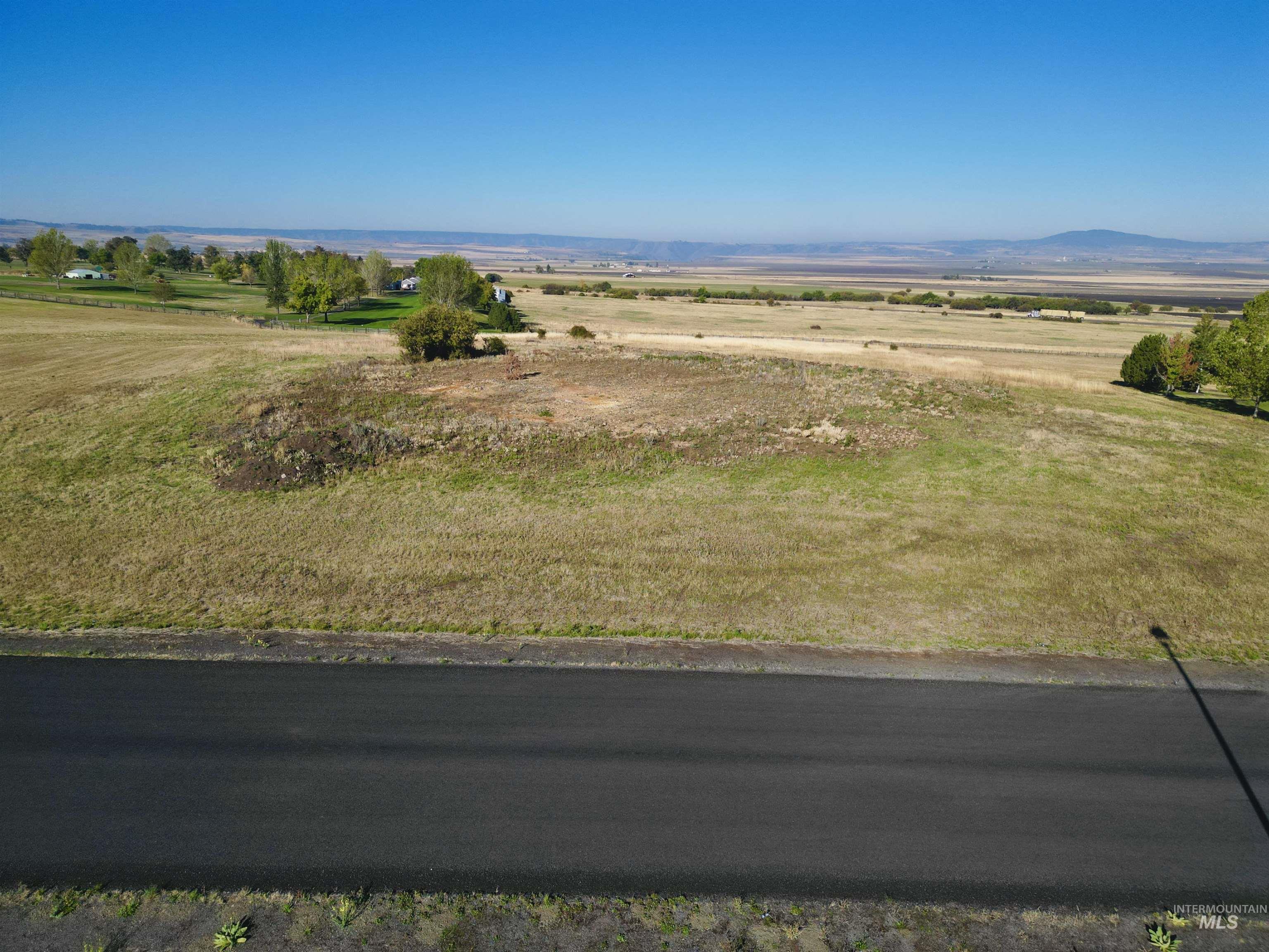 View of mountain backdrop featuring rural landscape