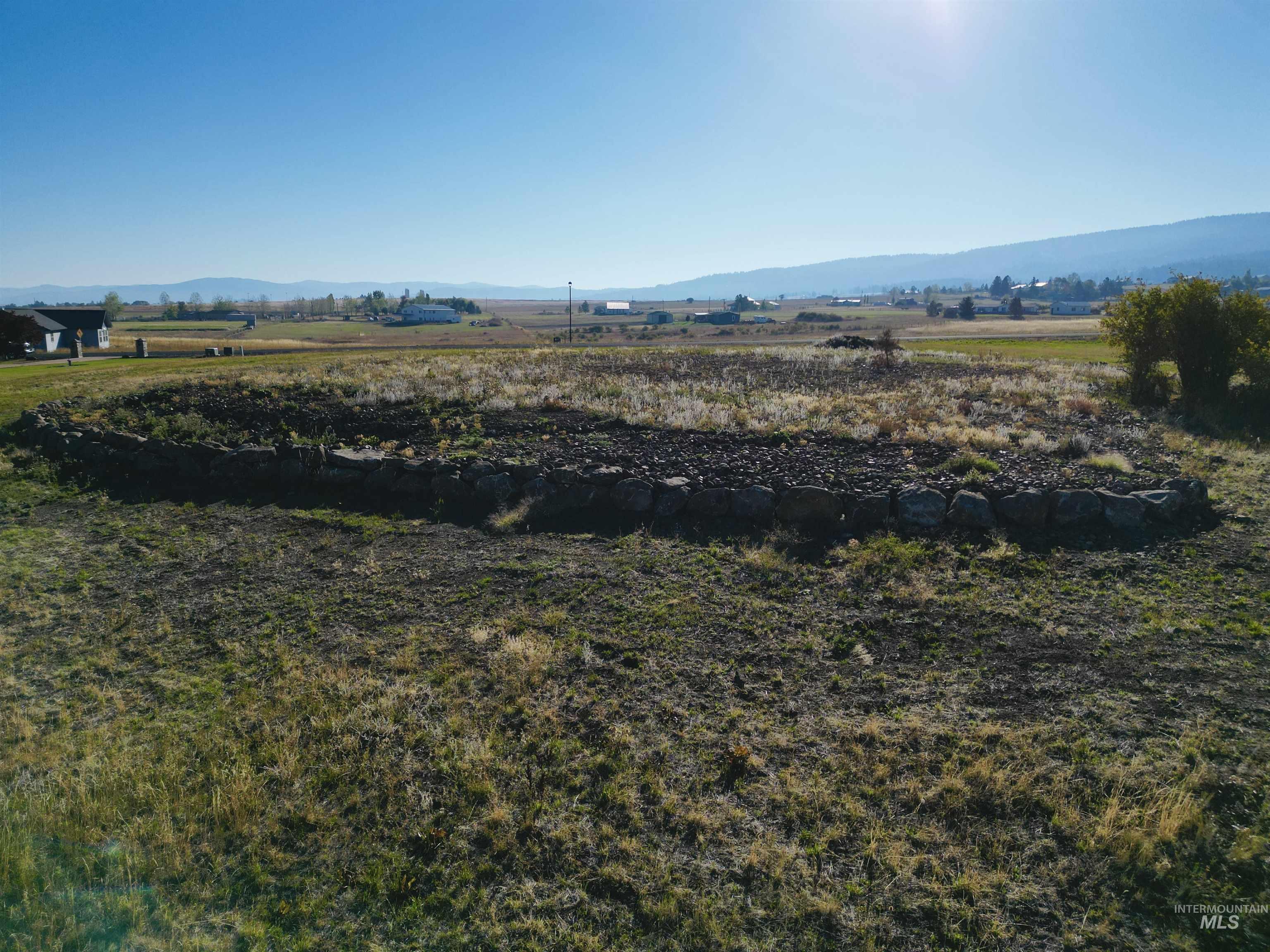 View of mountain background featuring rural landscape