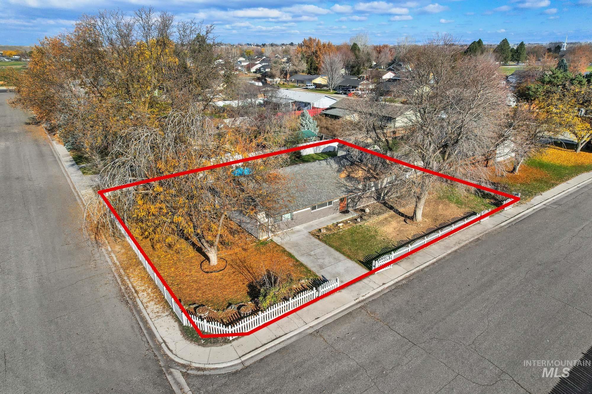 Aerial perspective of suburban area featuring property parcel outlined