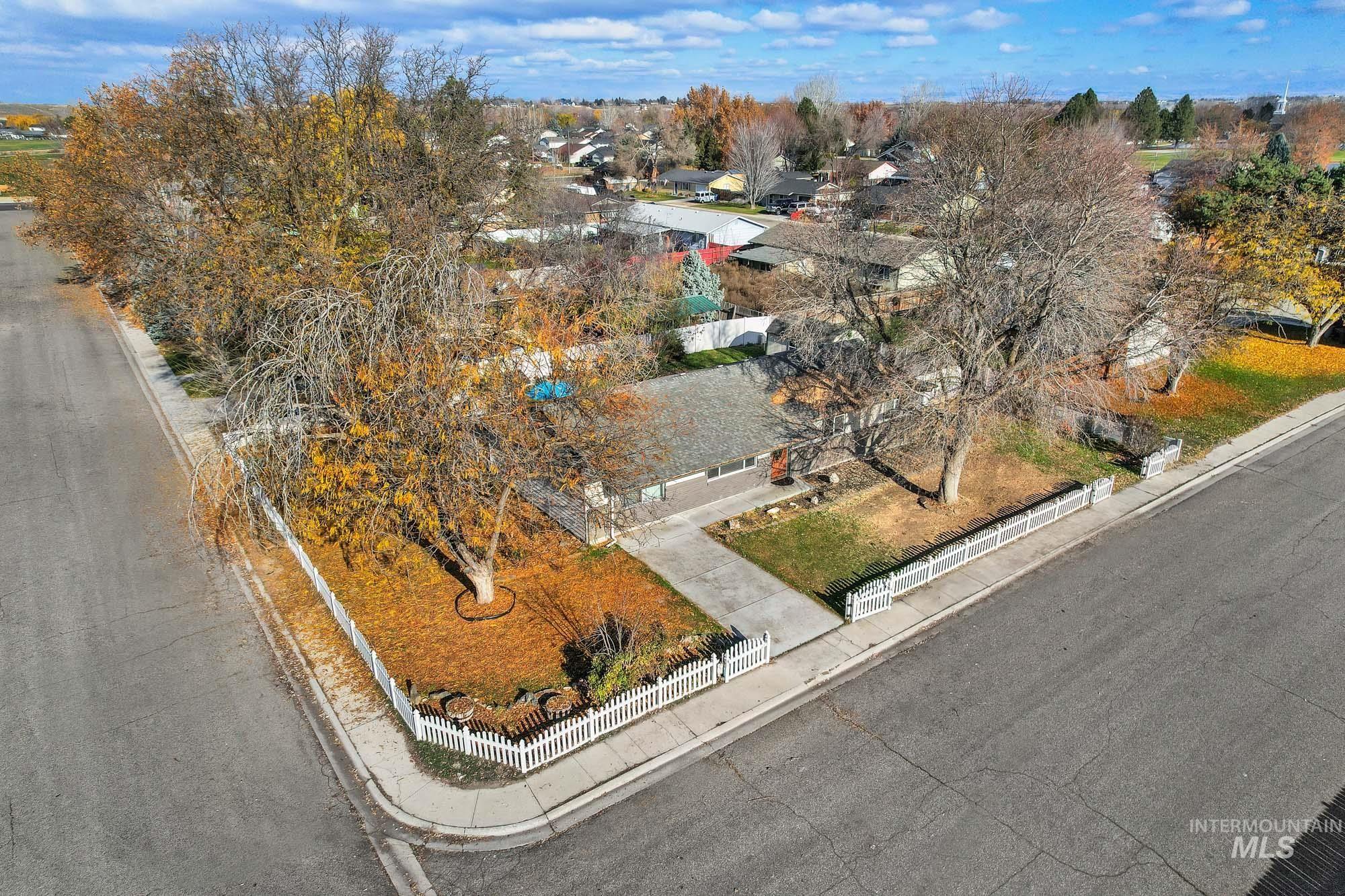 Aerial view of property's location with nearby suburban area