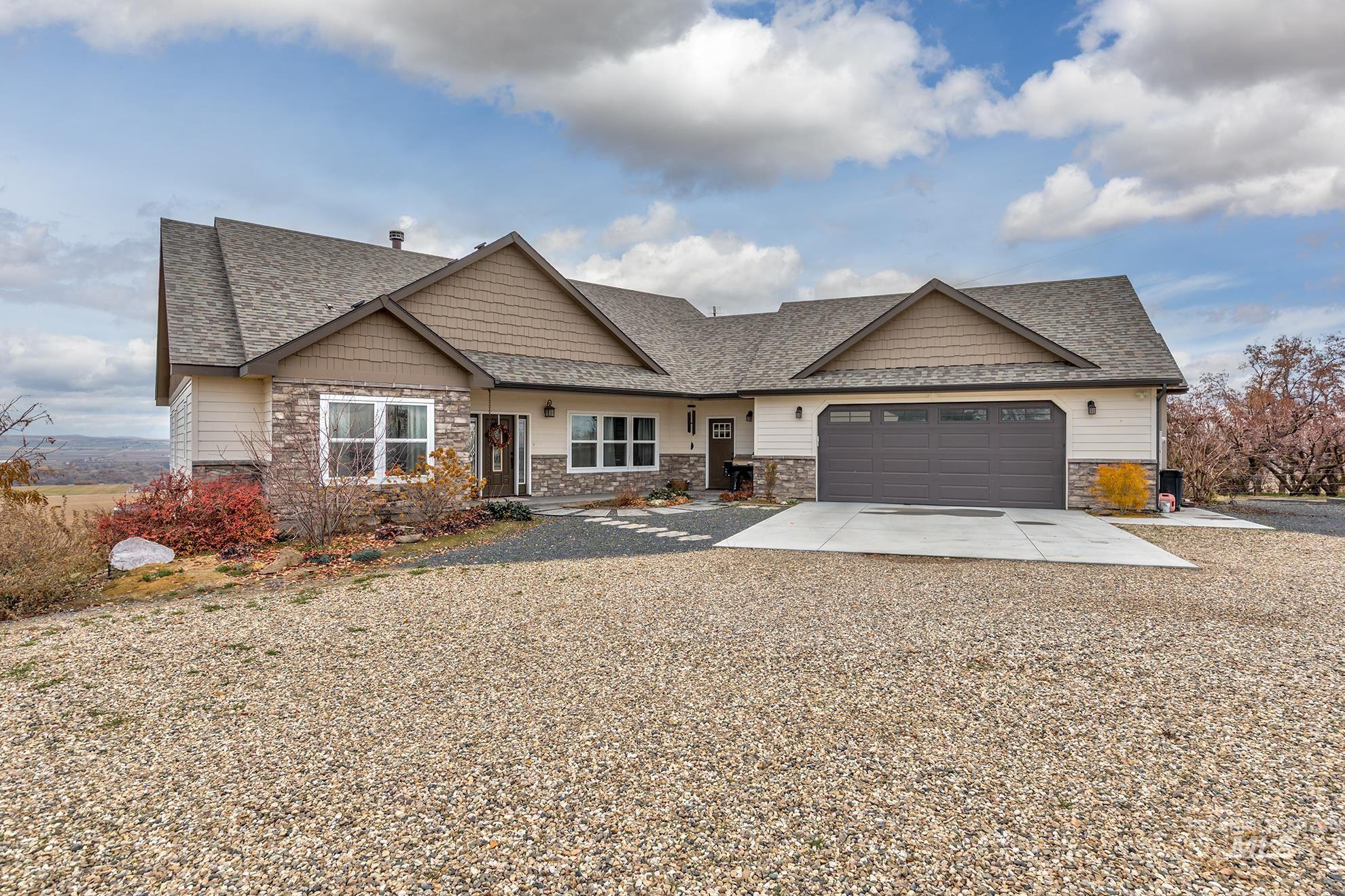 Craftsman house with roof with shingles and stone siding