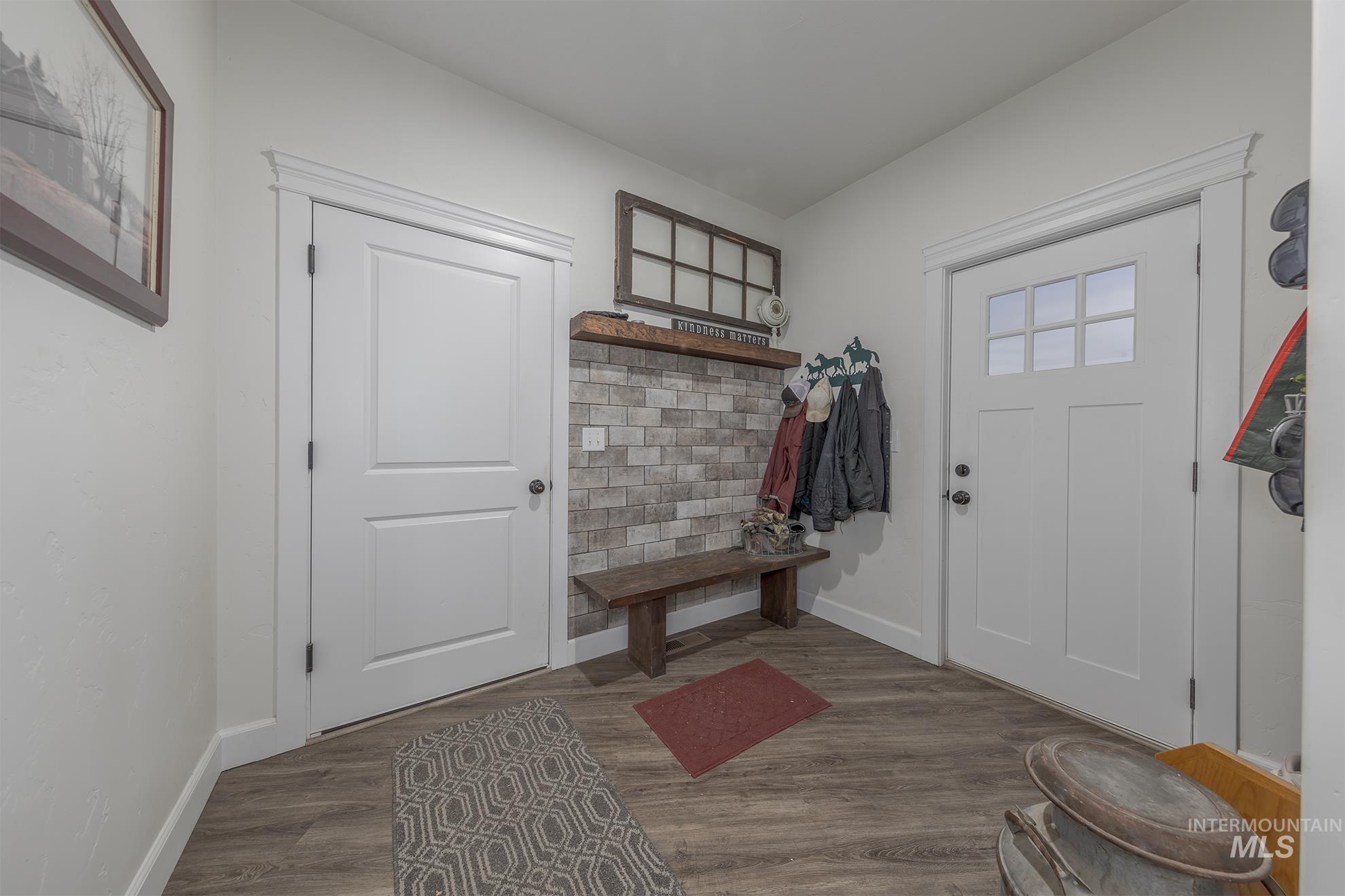 Mudroom featuring wood finished floors