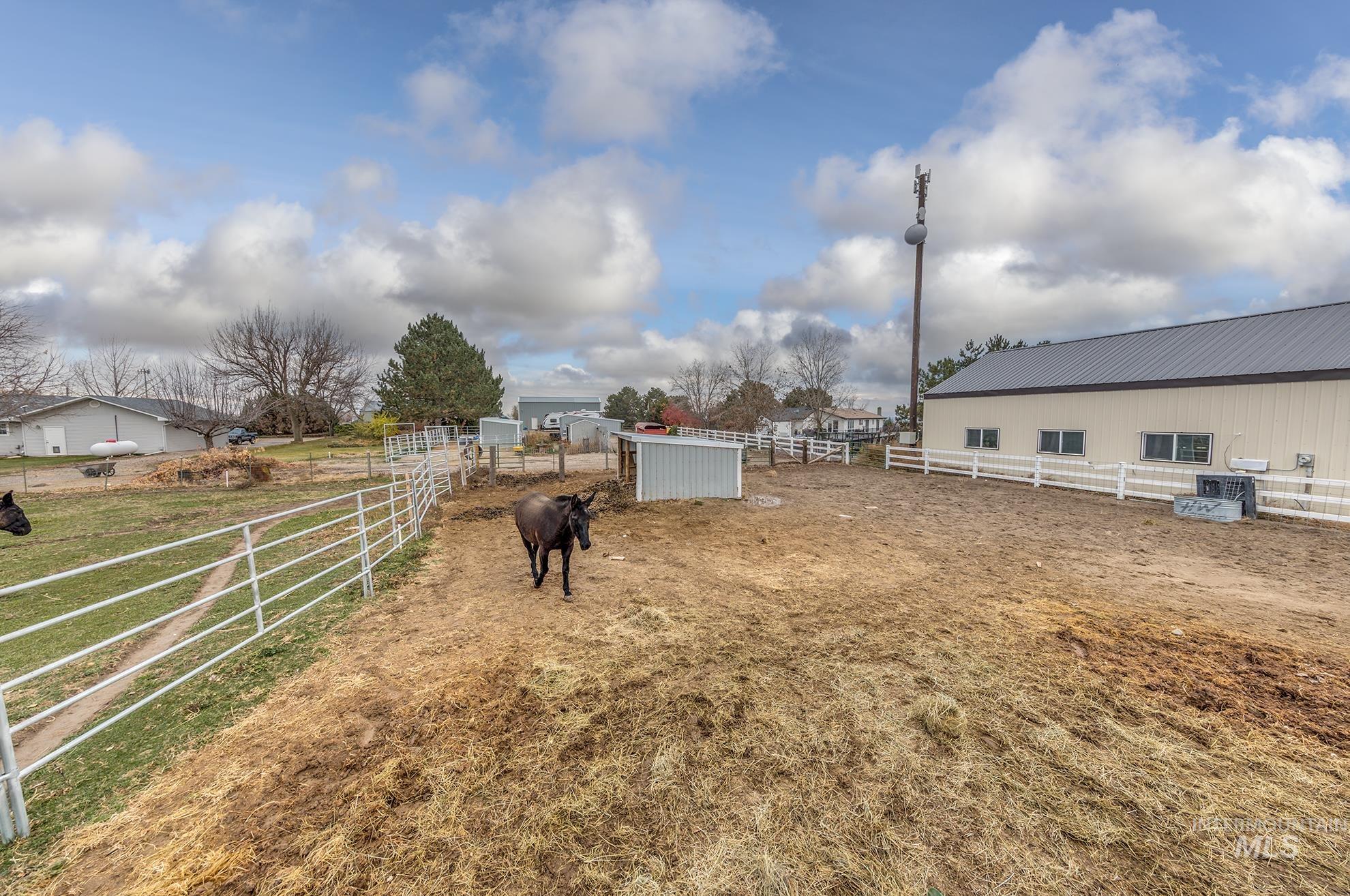 View of yard with an outdoor structure and a rural view