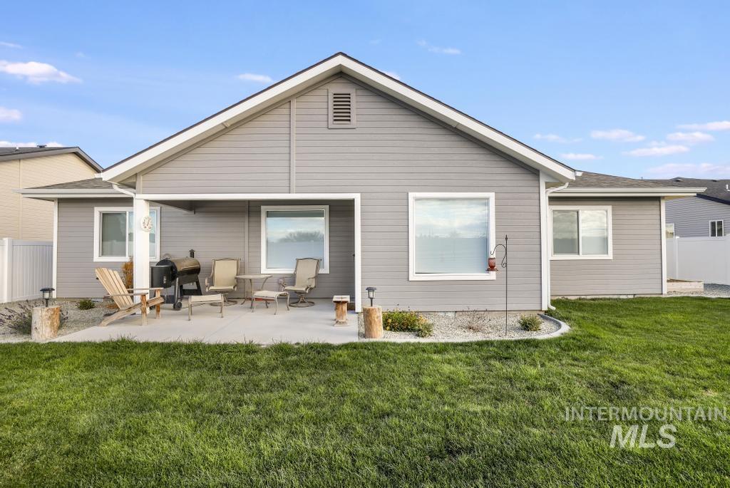 Rear view of property with a patio area
