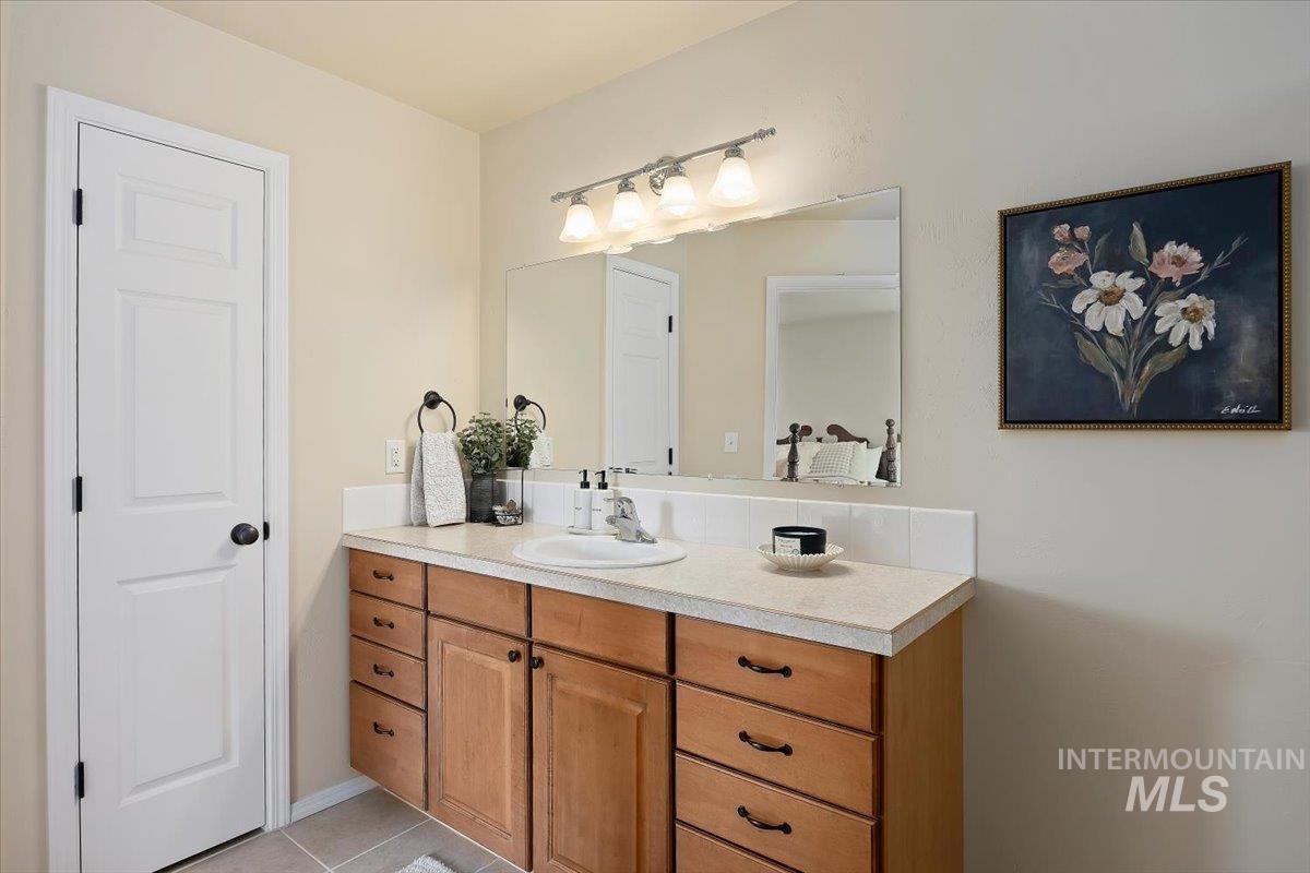 Bathroom featuring vanity and light tile patterned flooring