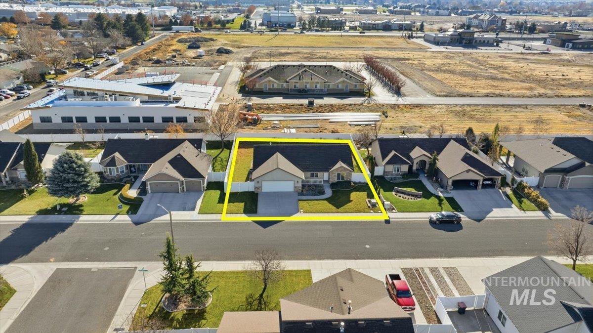 Aerial view of residential area with property parcel outlined