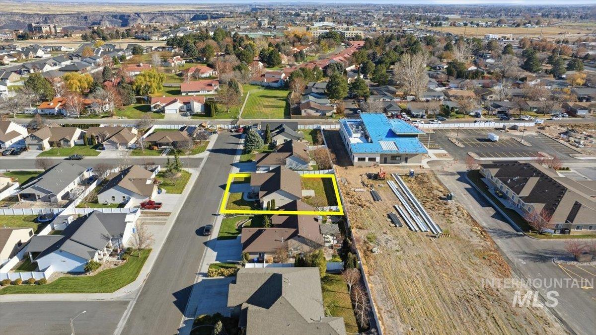 Aerial perspective of suburban area with property boundaries highlighted