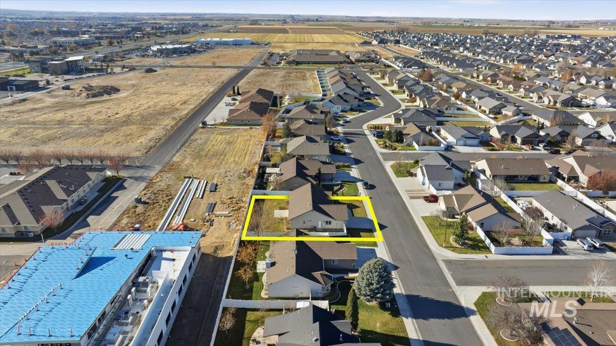 Aerial perspective of suburban area featuring property parcel outlined
