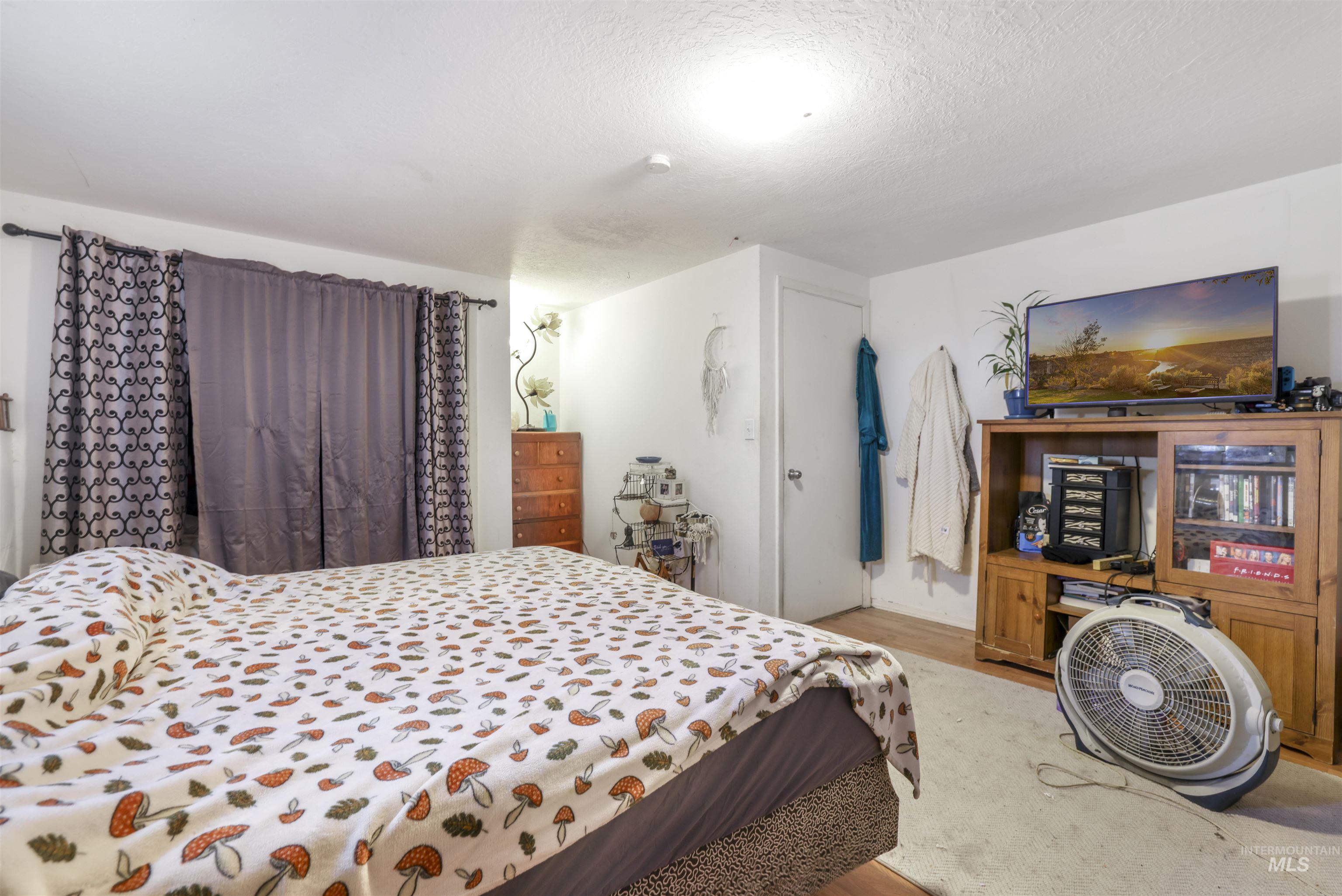 Bedroom with a textured ceiling