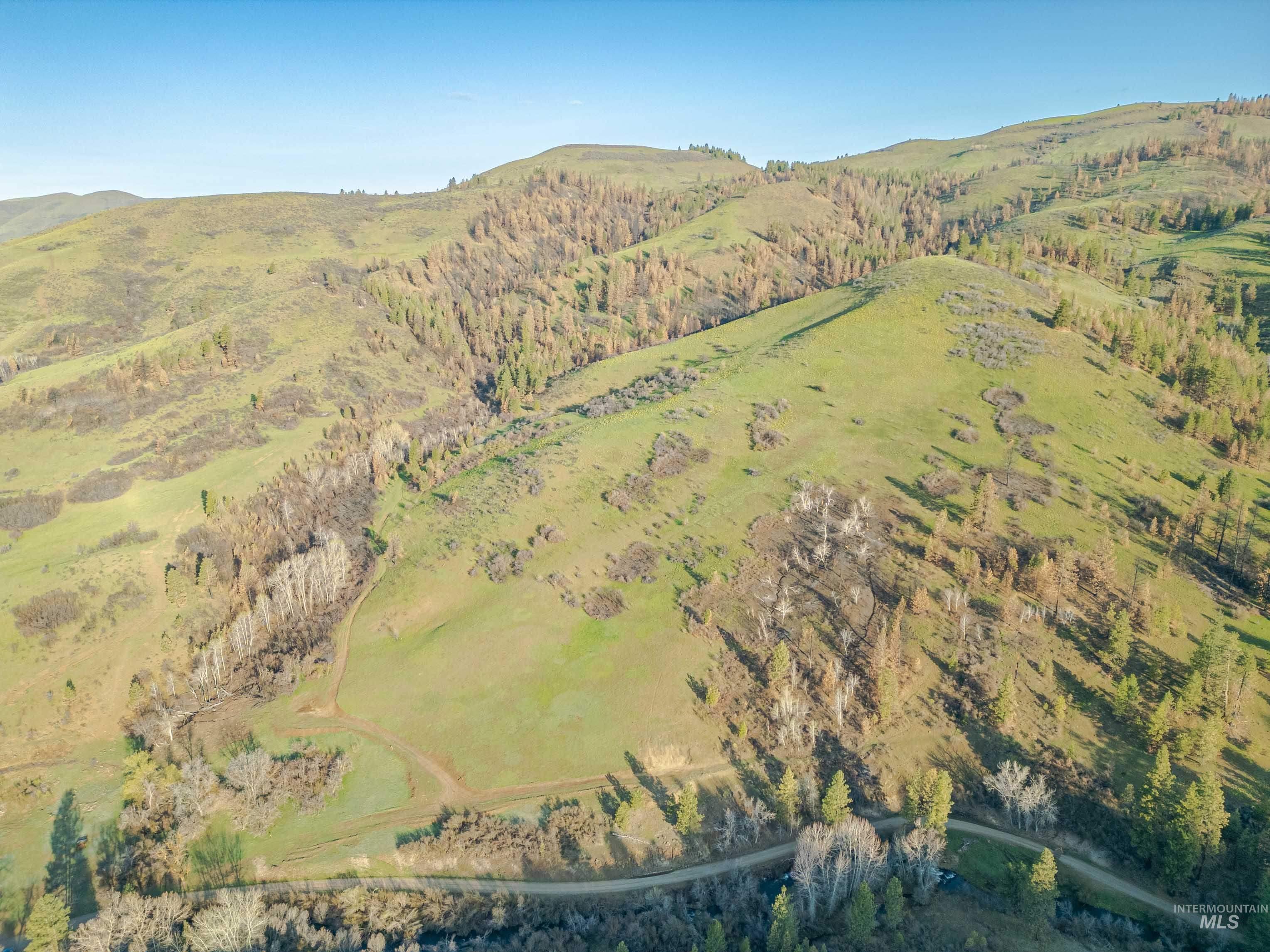 Aerial overview of property's location featuring mountains