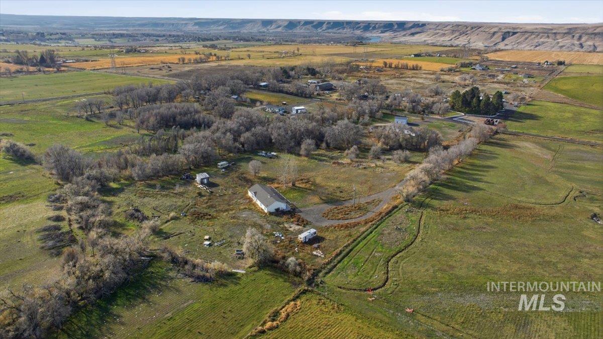 Aerial view of property and surrounding area with rural landscape
