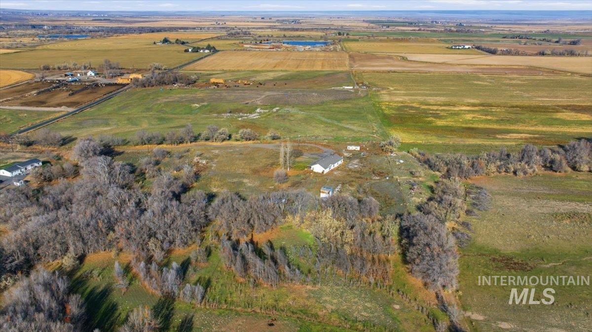Aerial view of property and surrounding area featuring rural landscape