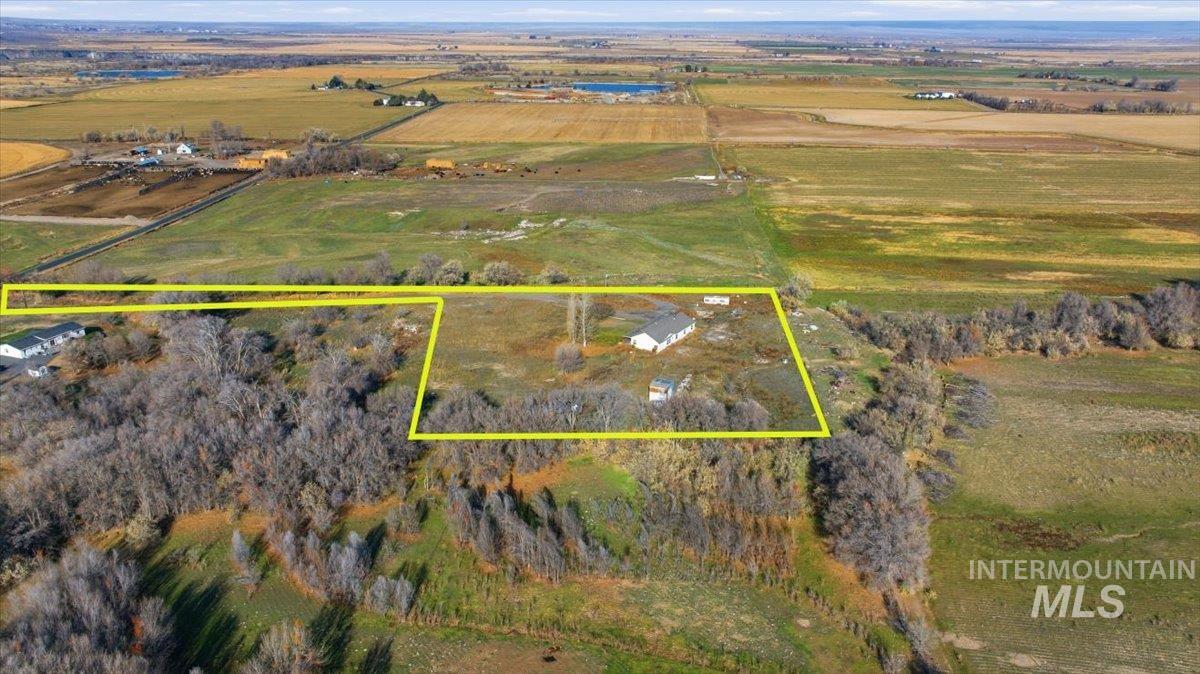 Aerial view of sparsely populated area with property boundaries highlighted