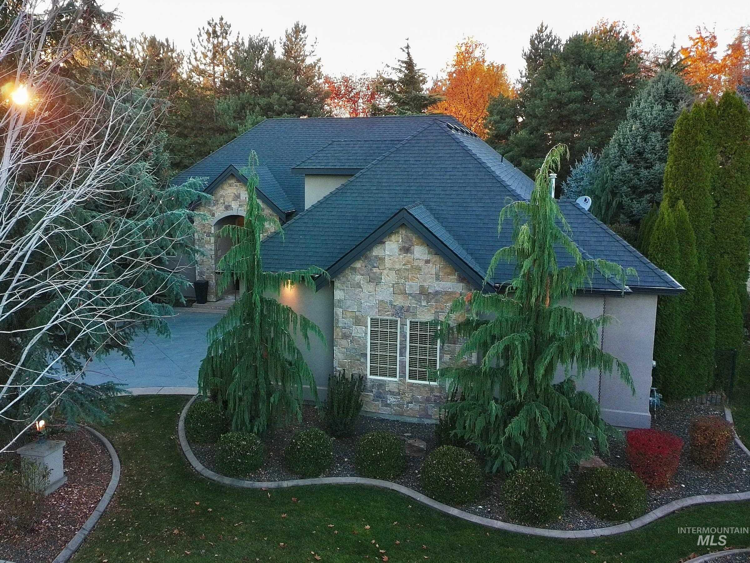 View of side of property with stone siding and stucco siding