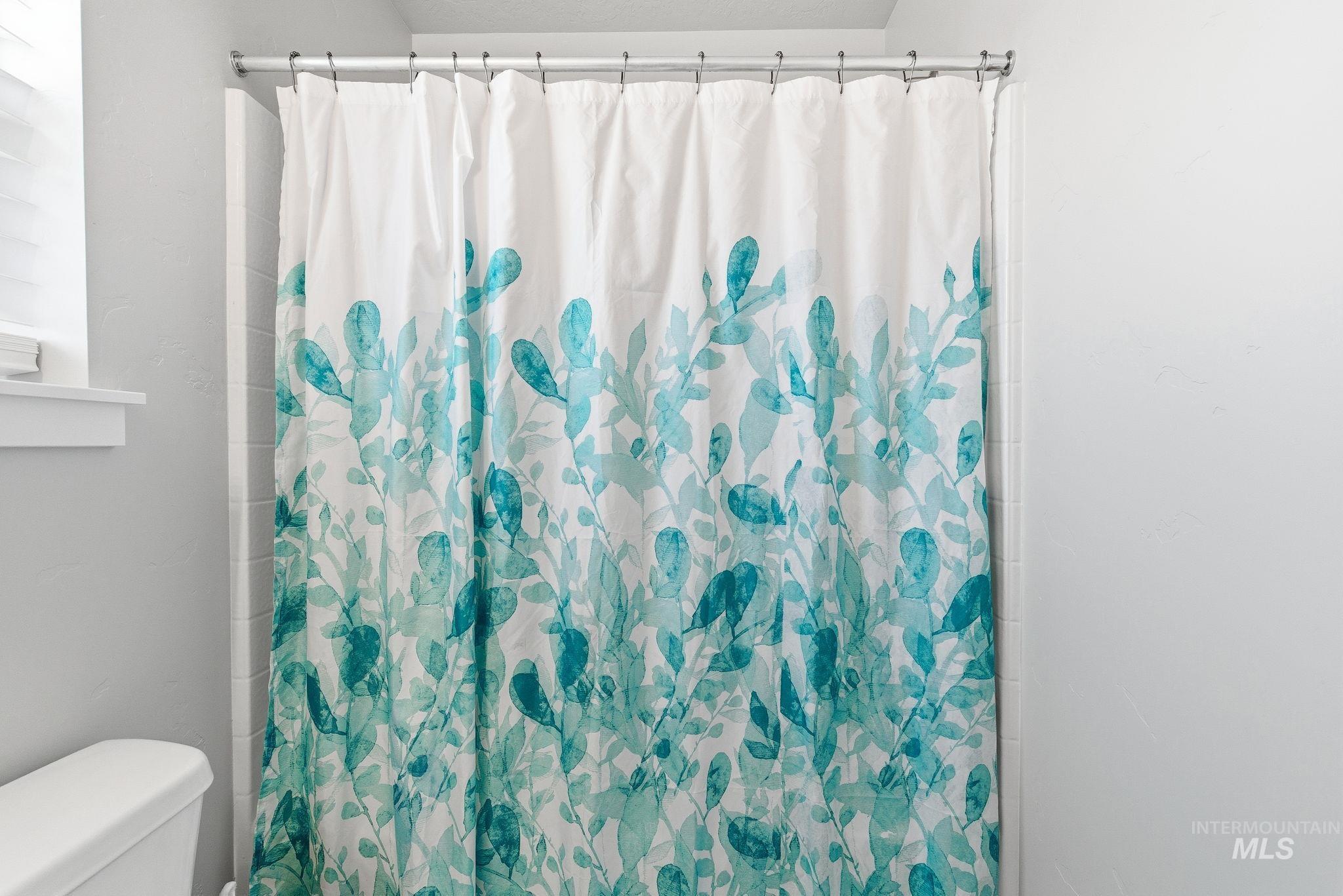 Full bath featuring curtained shower
